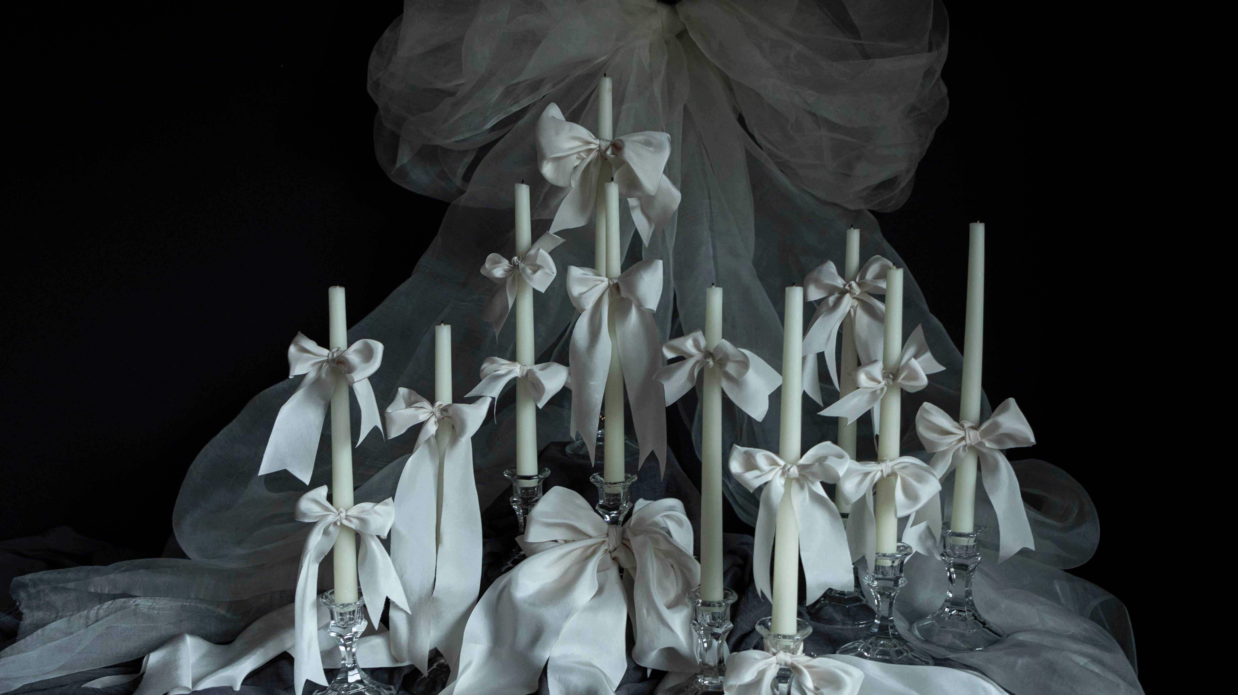 The Art of Ribbon Bows on Candles for Special Events