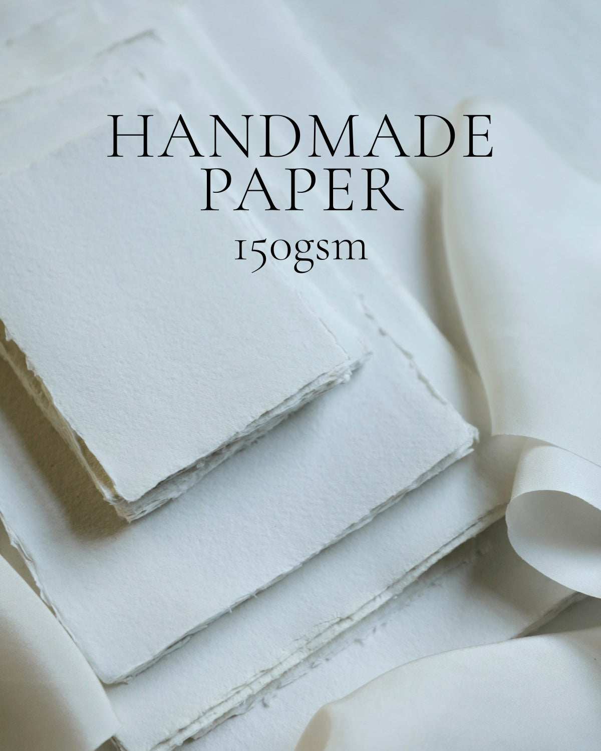 Stack of handmade paper with text indicating weight on a light background