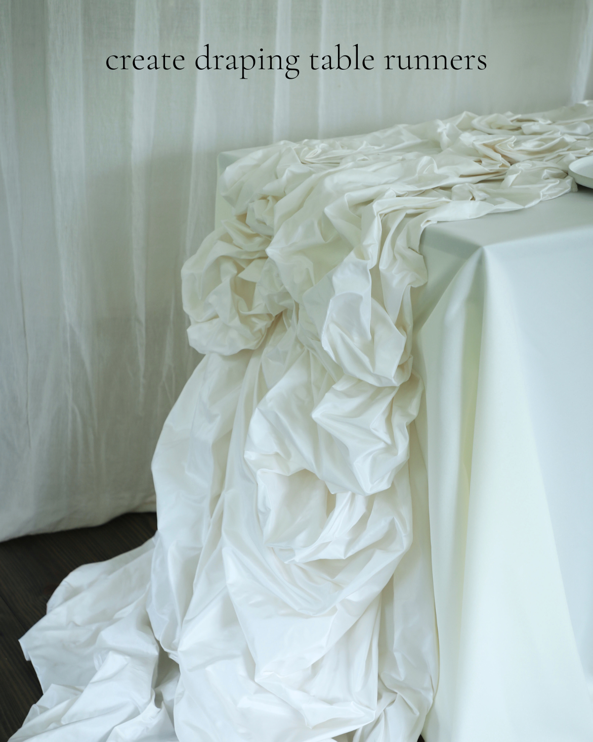 White floral table runner draped over a table with text 'create draping table runners' on a plain background.