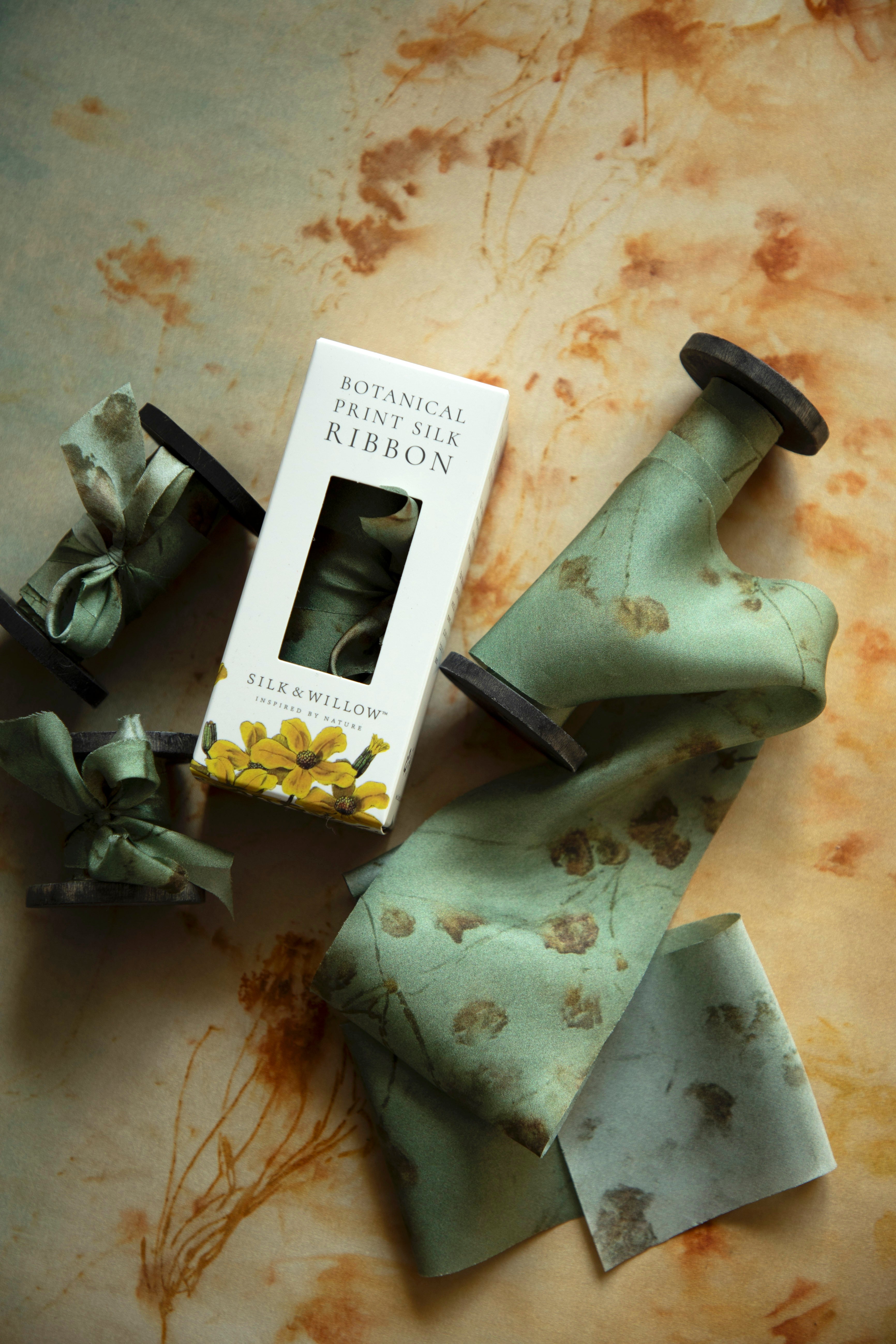 Eco-friendly silk ribbons with nature-inspired patterns, perfect for unique gift wrapping and tying market bouquets, crafted from sustainable materials