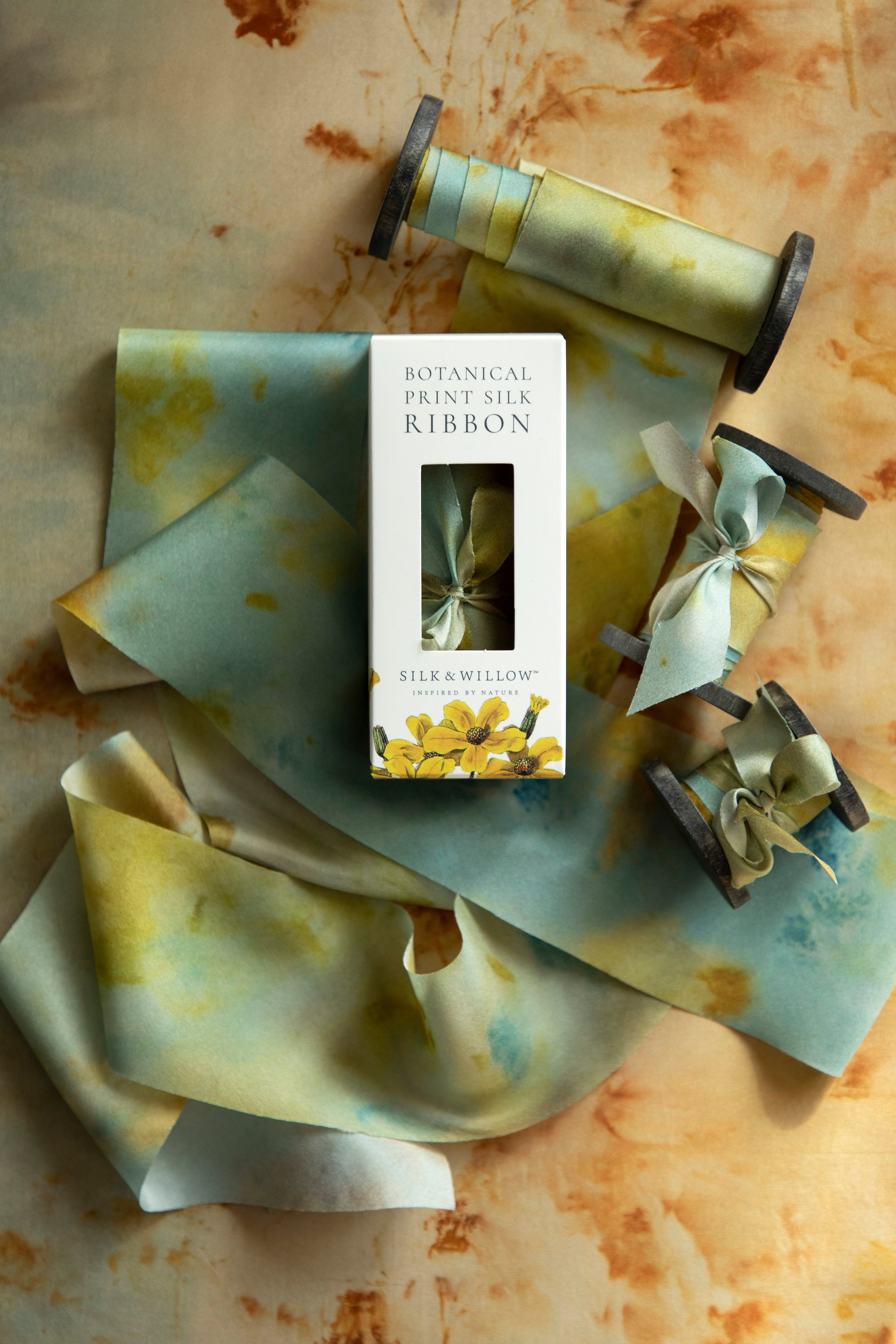 Eco-friendly silk ribbons with nature-inspired patterns, perfect for unique gift wrapping and tying market bouquets, crafted from sustainable materials