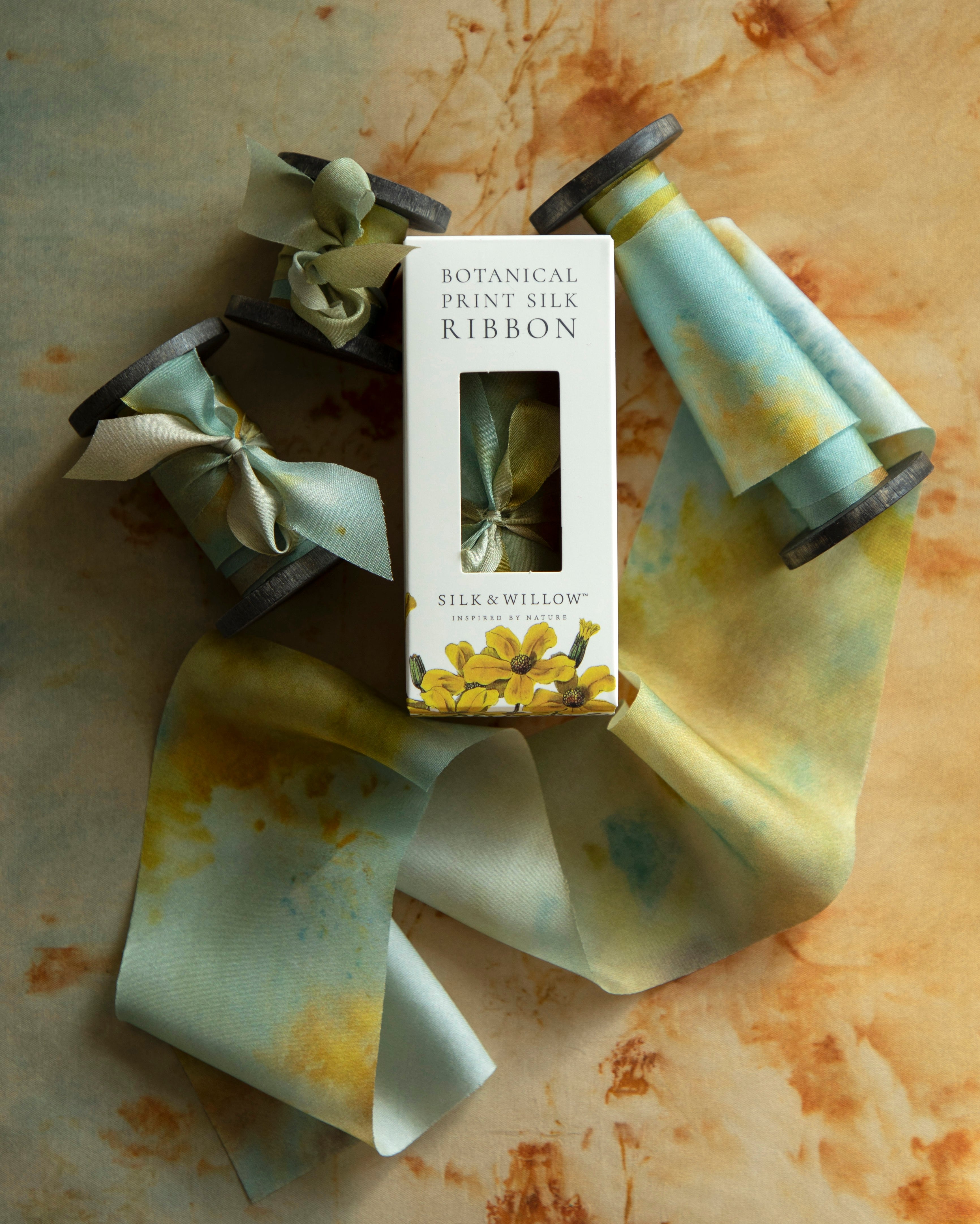 Eco-friendly silk ribbons with nature-inspired patterns, perfect for unique gift wrapping and tying market bouquets, crafted from sustainable materials