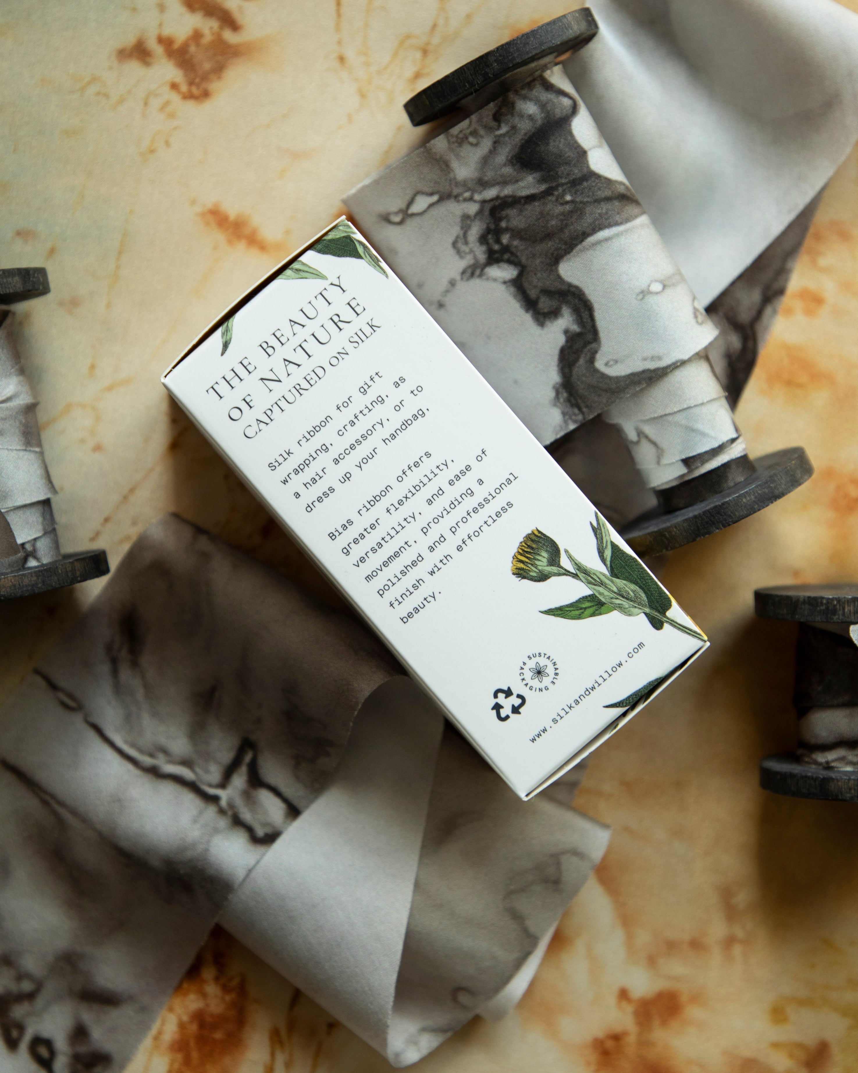 Eco-friendly silk ribbons with nature-inspired patterns, perfect for unique gift wrapping and tying market bouquets, crafted from sustainable materials