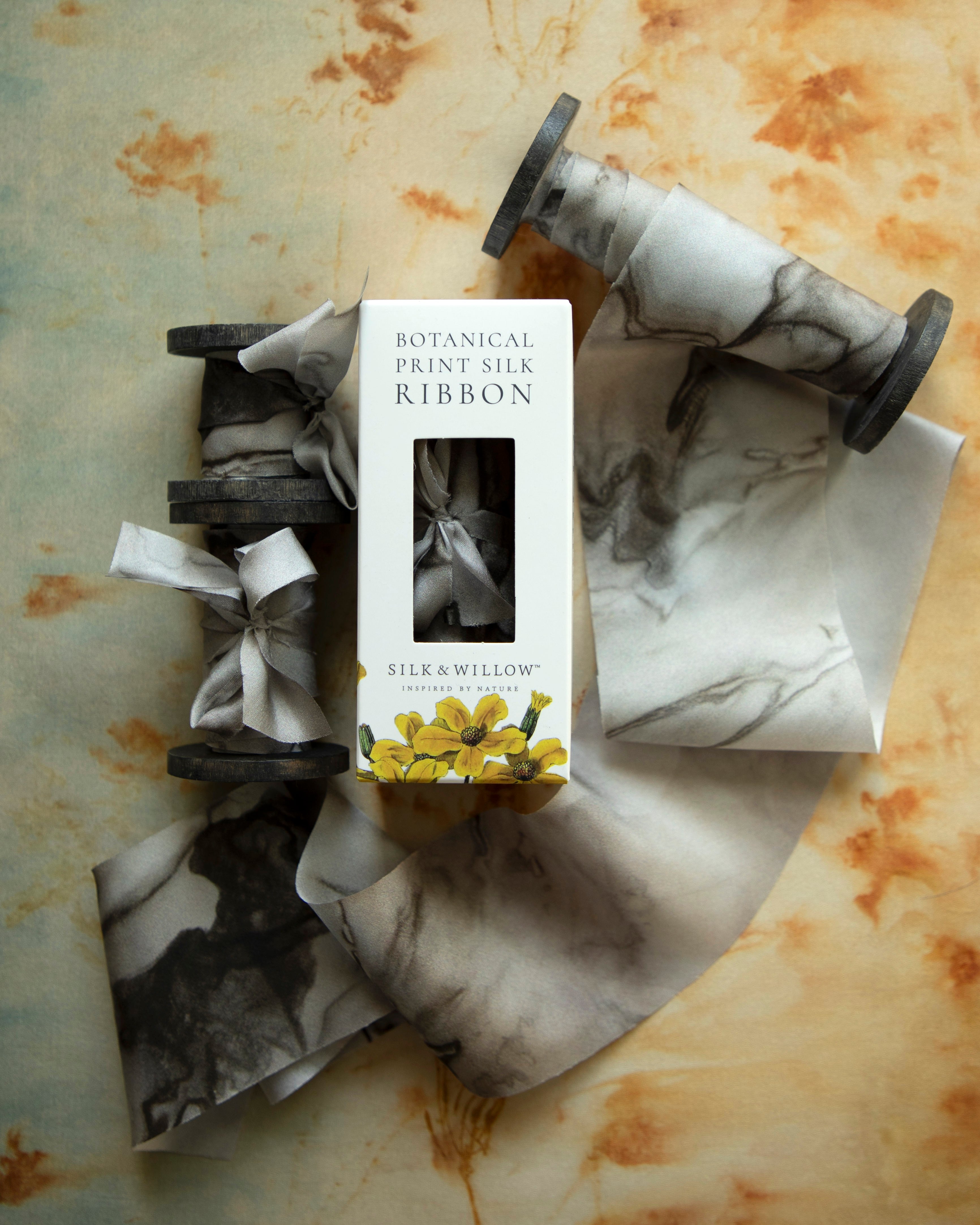 Eco-friendly silk ribbons with nature-inspired patterns, perfect for unique gift wrapping and tying market bouquets, crafted from sustainable materials