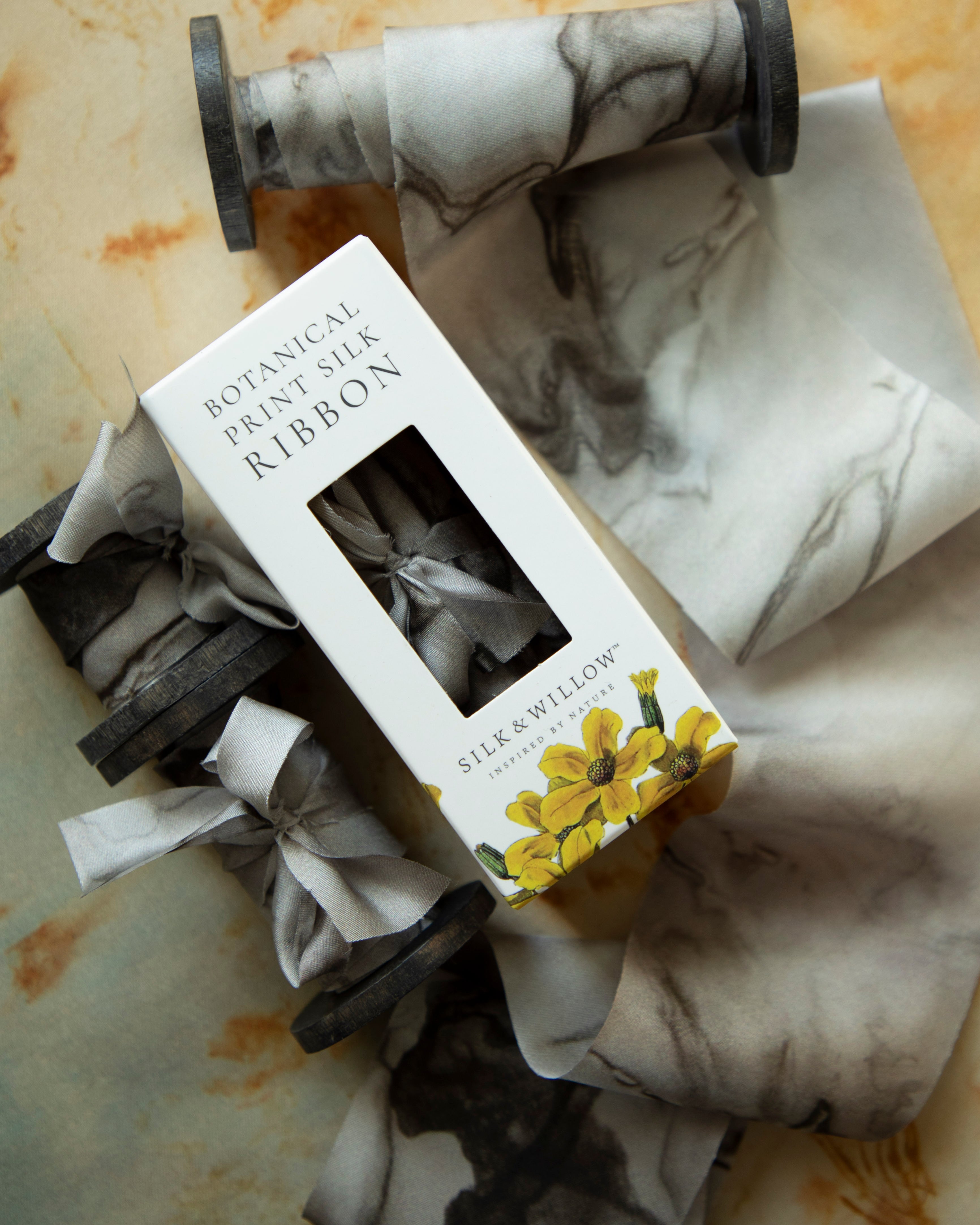 Eco-friendly silk ribbons with nature-inspired patterns, perfect for unique gift wrapping and tying market bouquets, crafted from sustainable materials