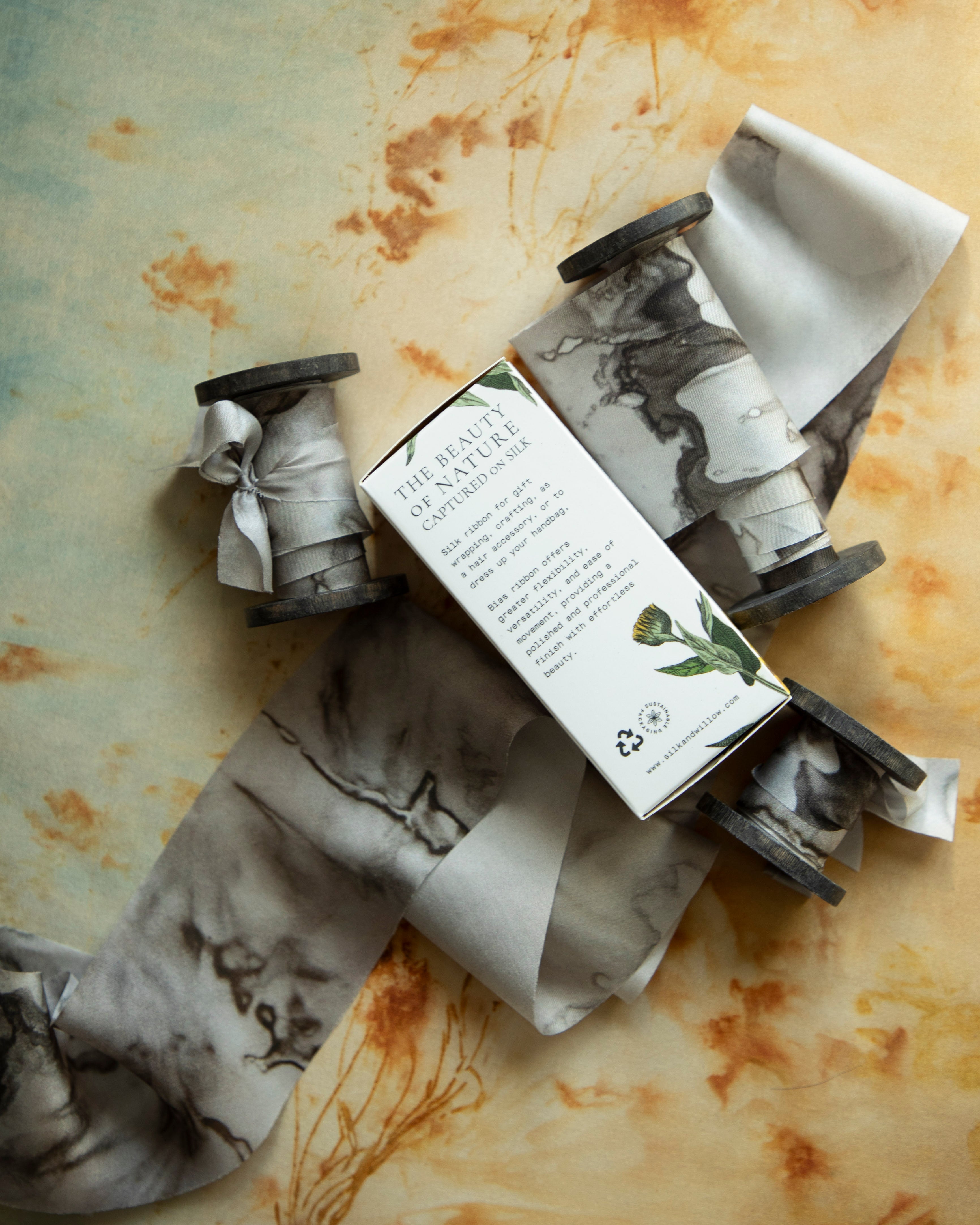 Eco-friendly silk ribbons with nature-inspired patterns, perfect for unique gift wrapping and tying market bouquets, crafted from sustainable materials
