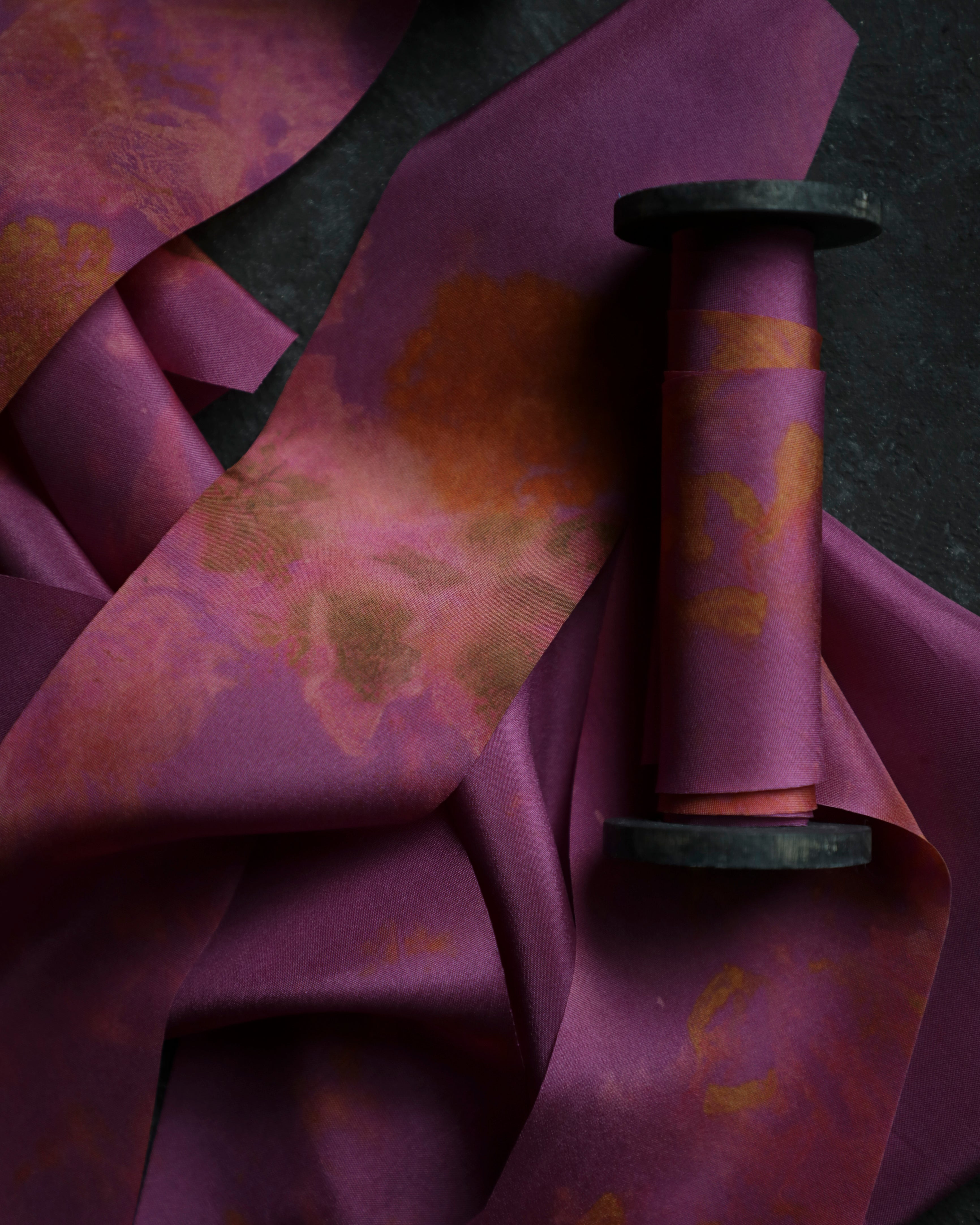 Close-up of purple fabric with floral patterns