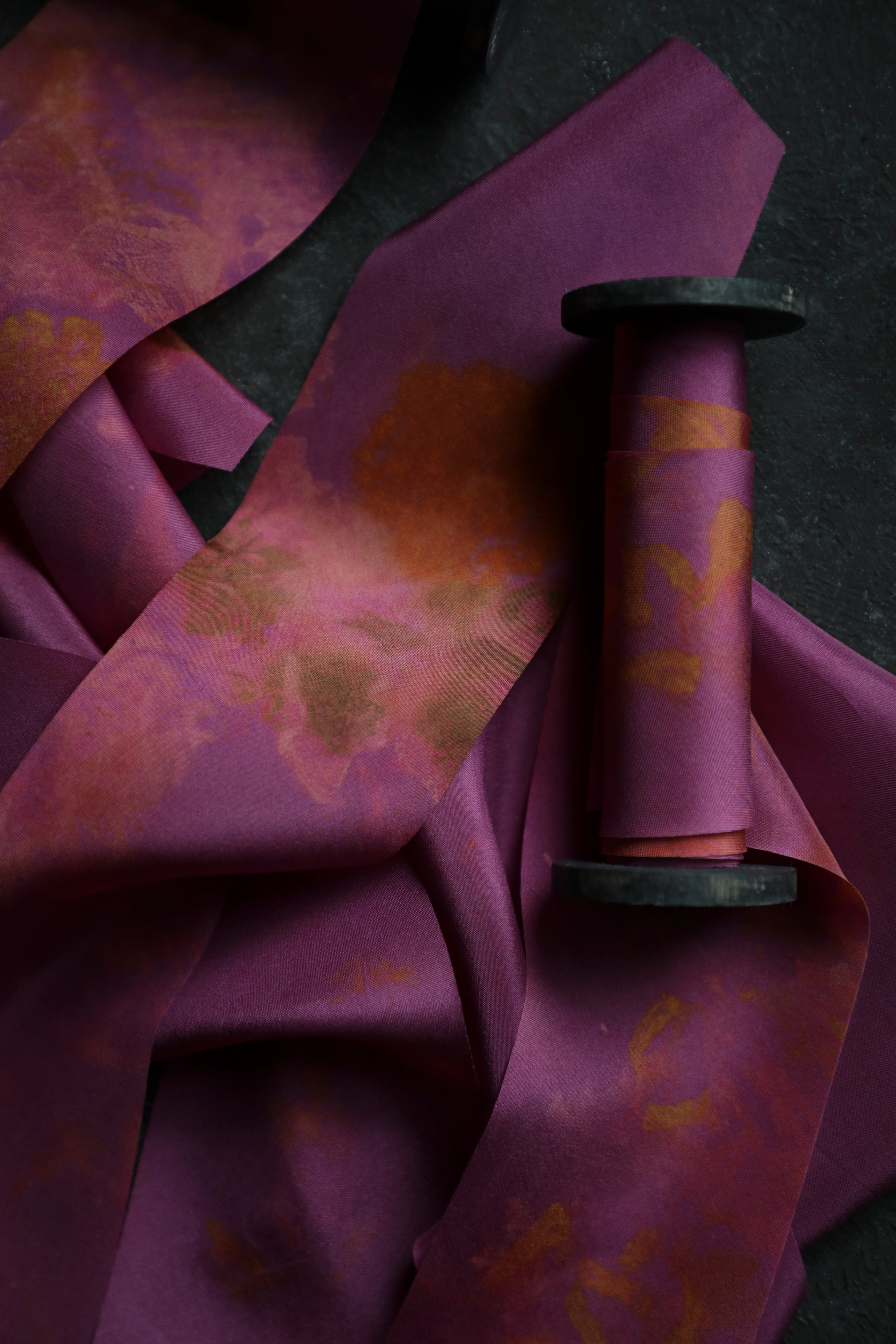 Close-up of purple fabric with floral patterns