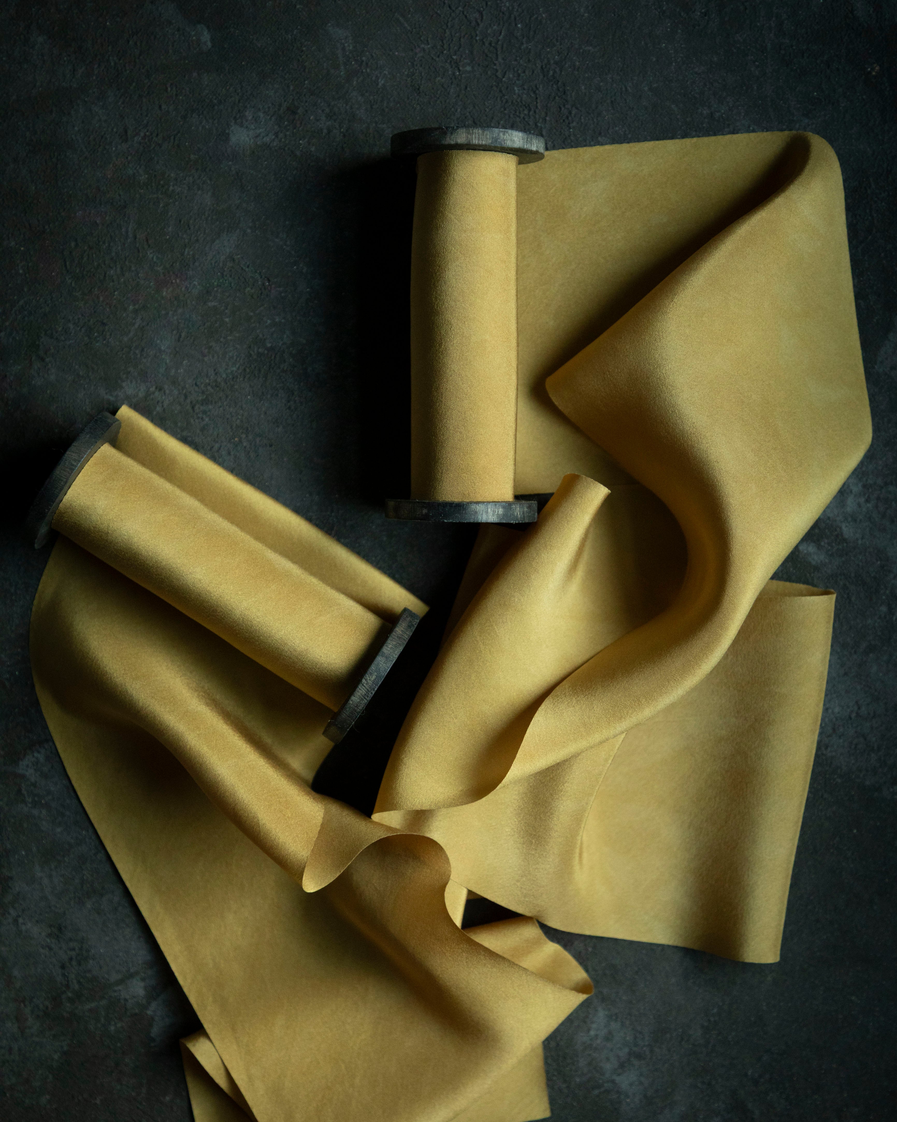 Yellow ribbons on a dark surface