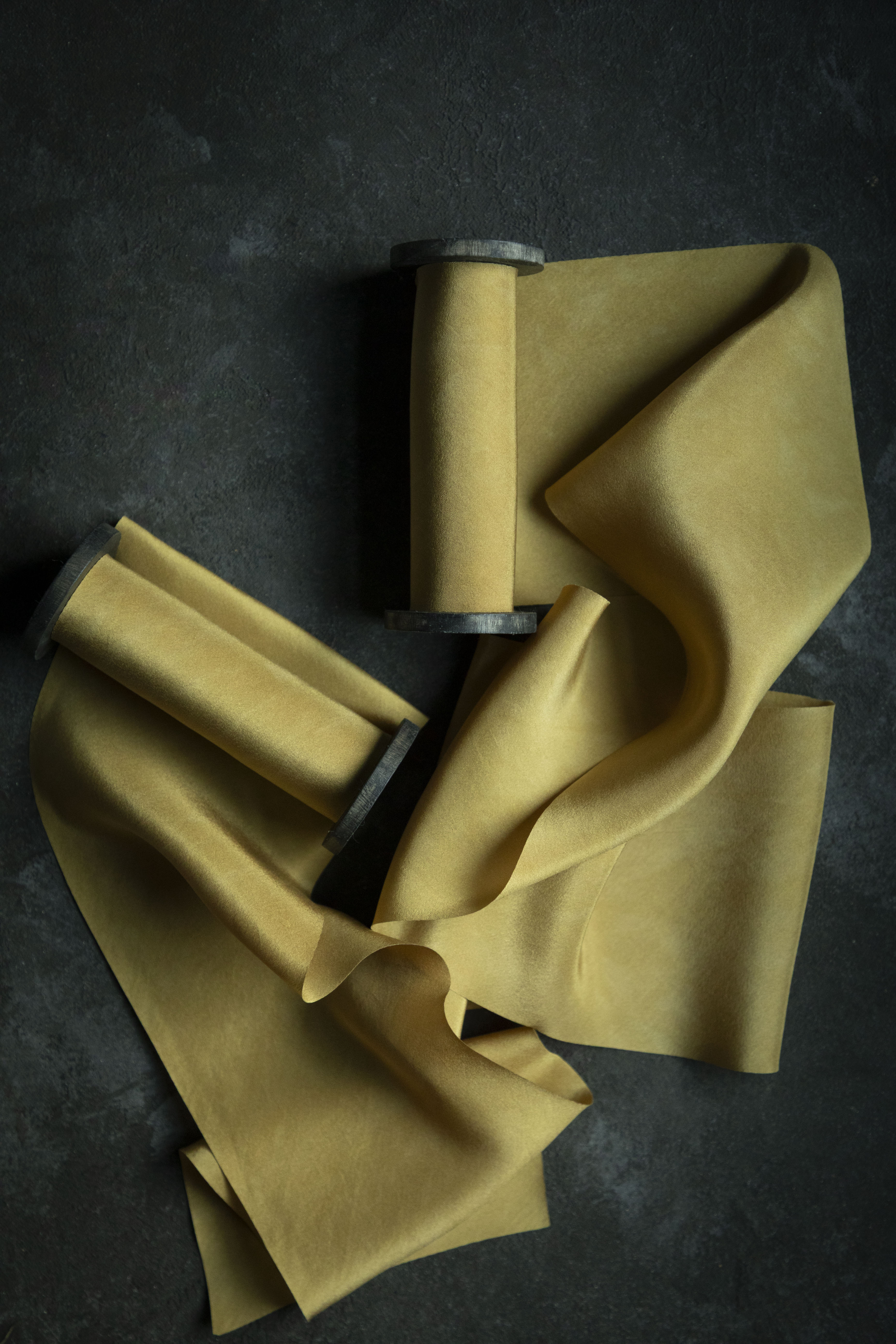 Yellow ribbons on a dark surface