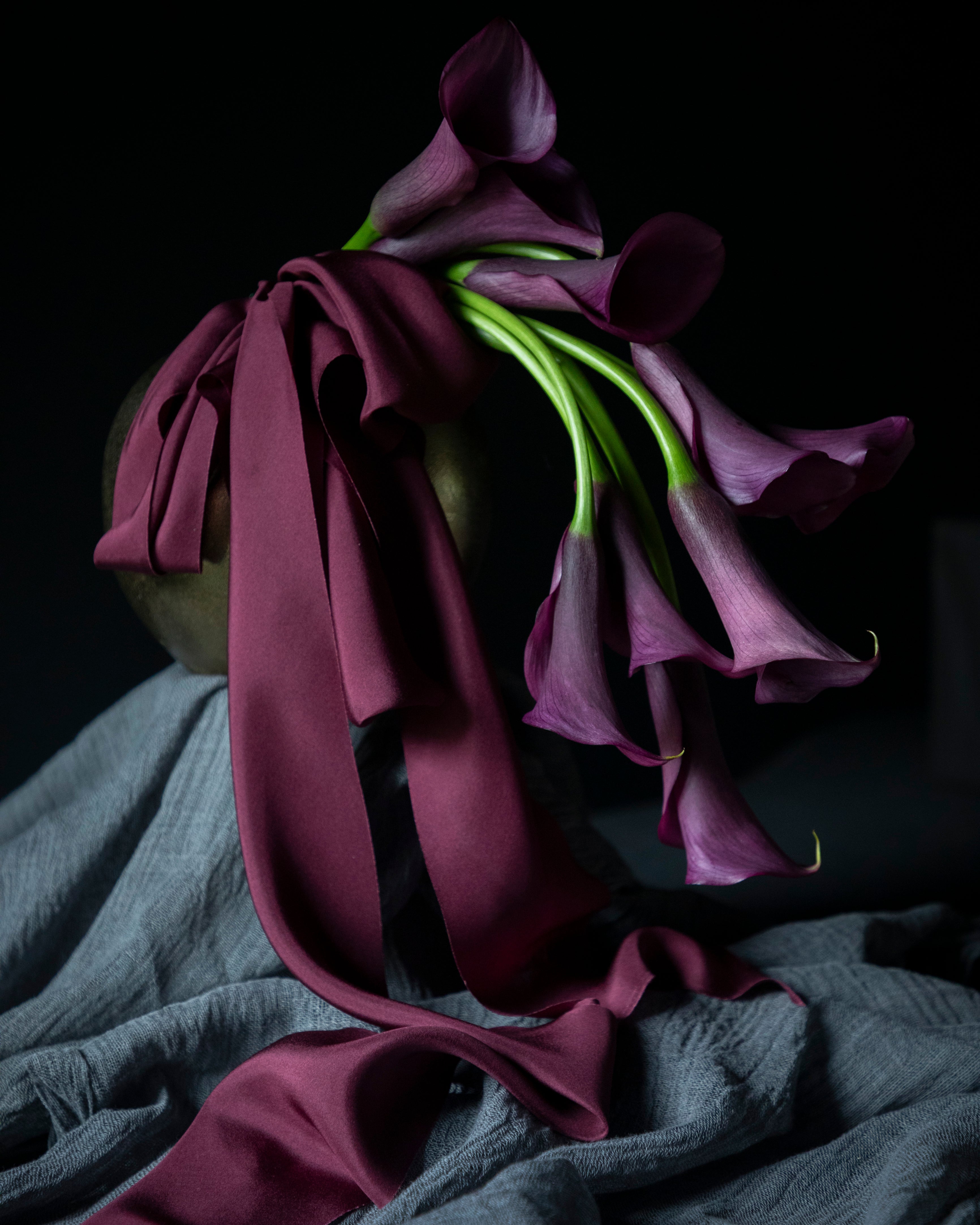 purple calla lily flower arrangement with purple silk ribbon