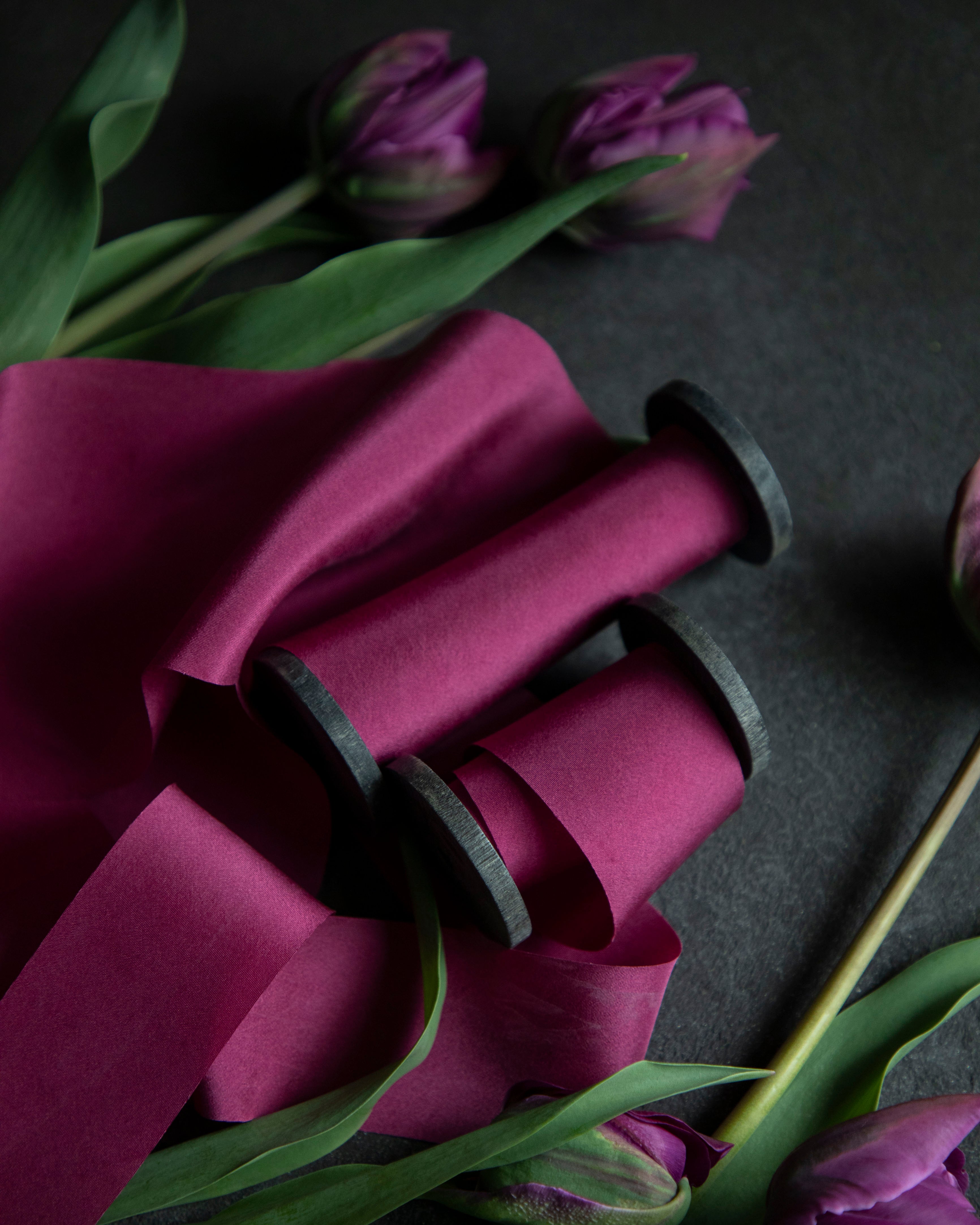 custom pink ribbon paired with purple tulip flowers