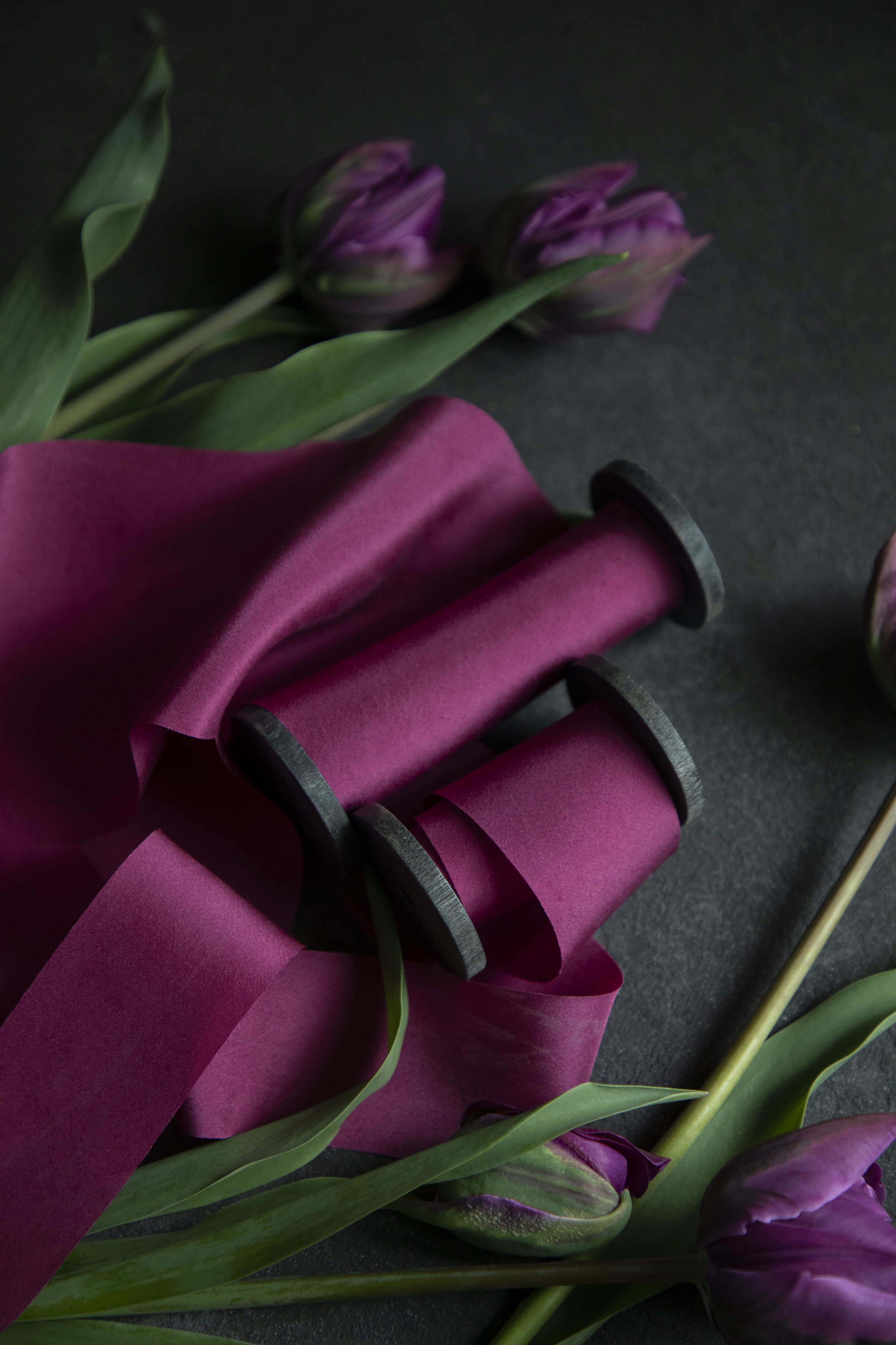 custom pink ribbon paired with purple tulip flowers