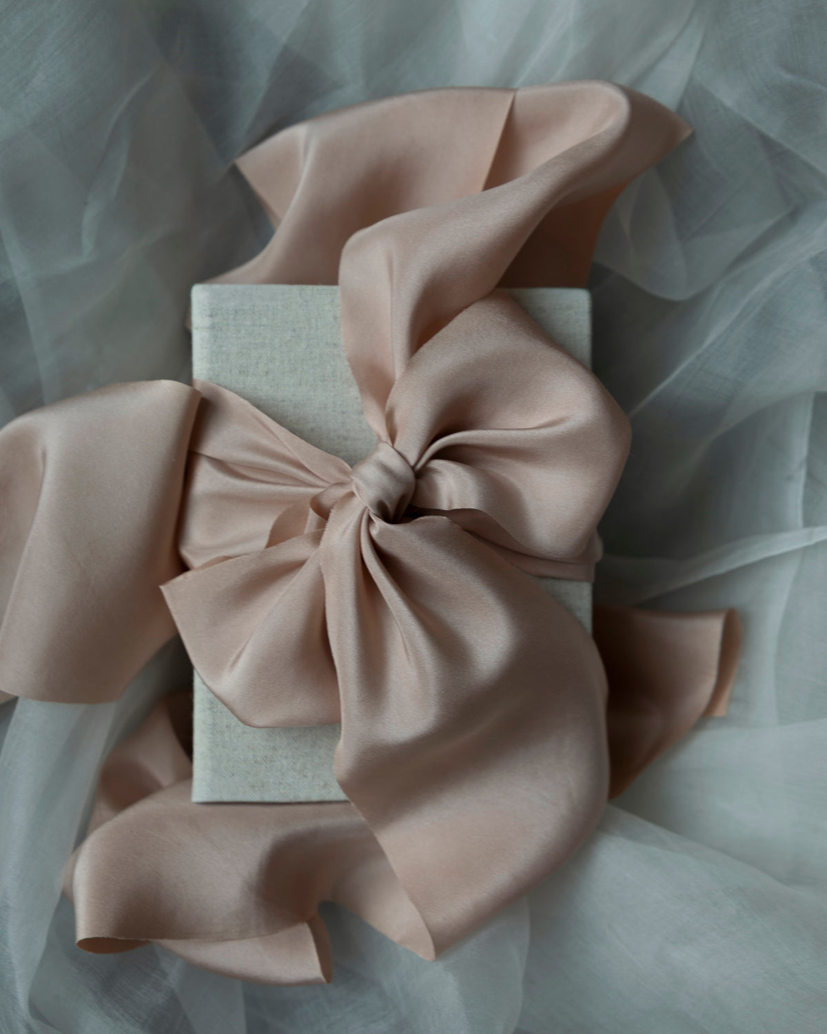 blush ribbon bow on linen gift box