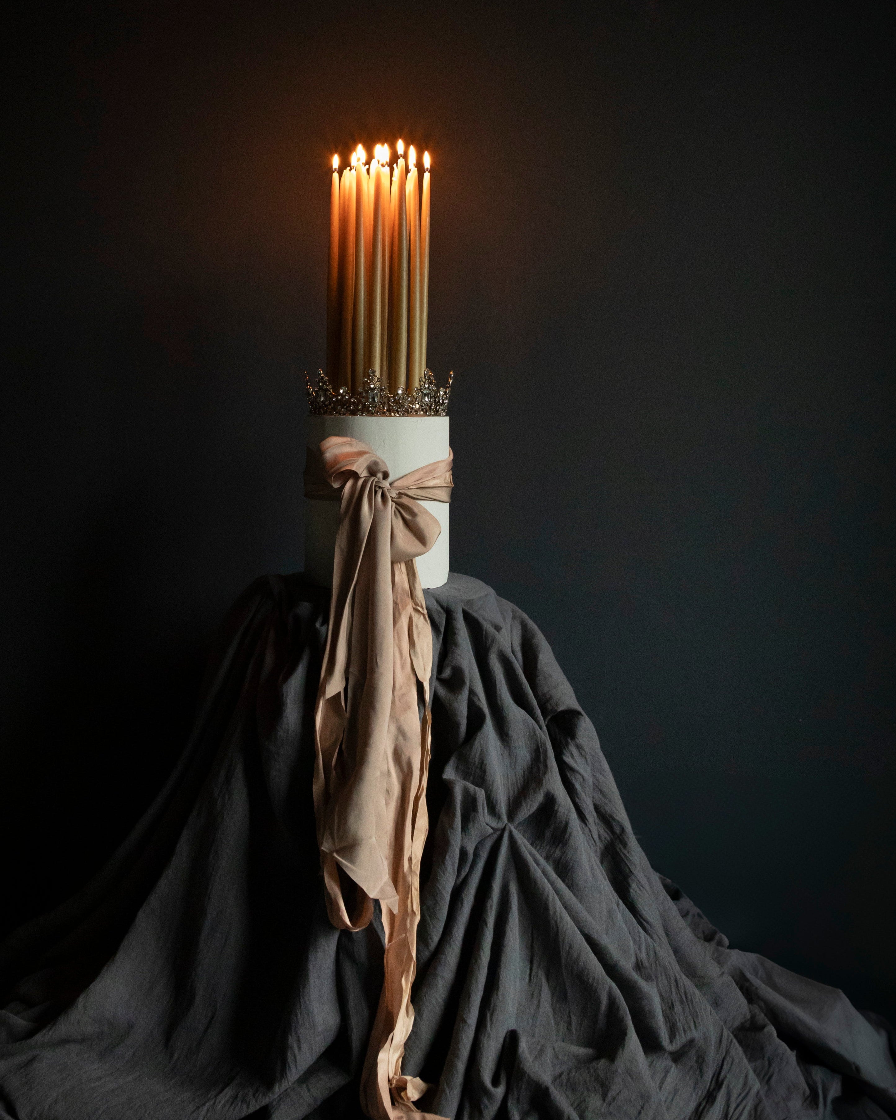 A charcoal gray, solid Orion table runner displayed on a dark background, presented in a manner that highlights its texture and color.