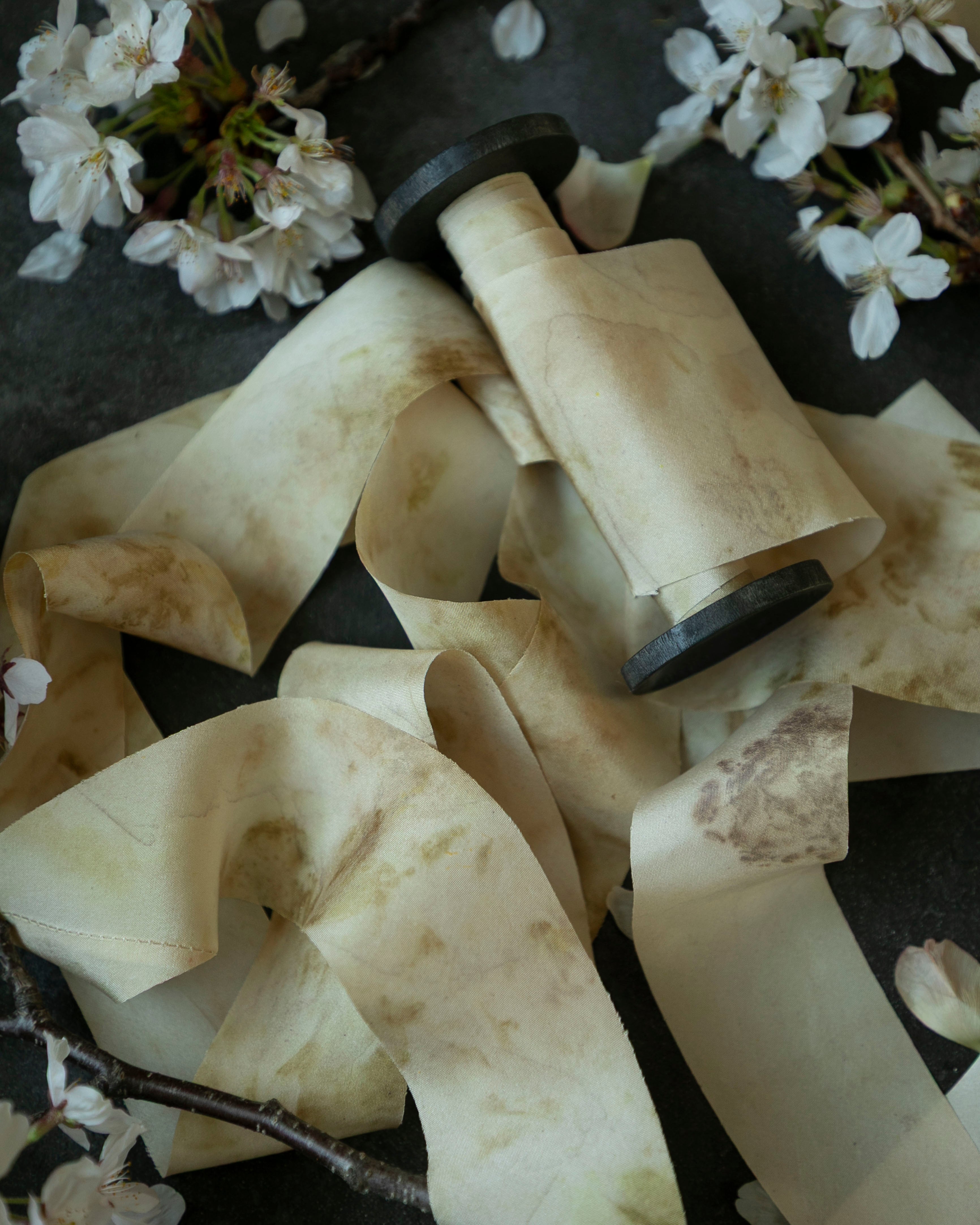 silk ribbon on wood spool with flowers