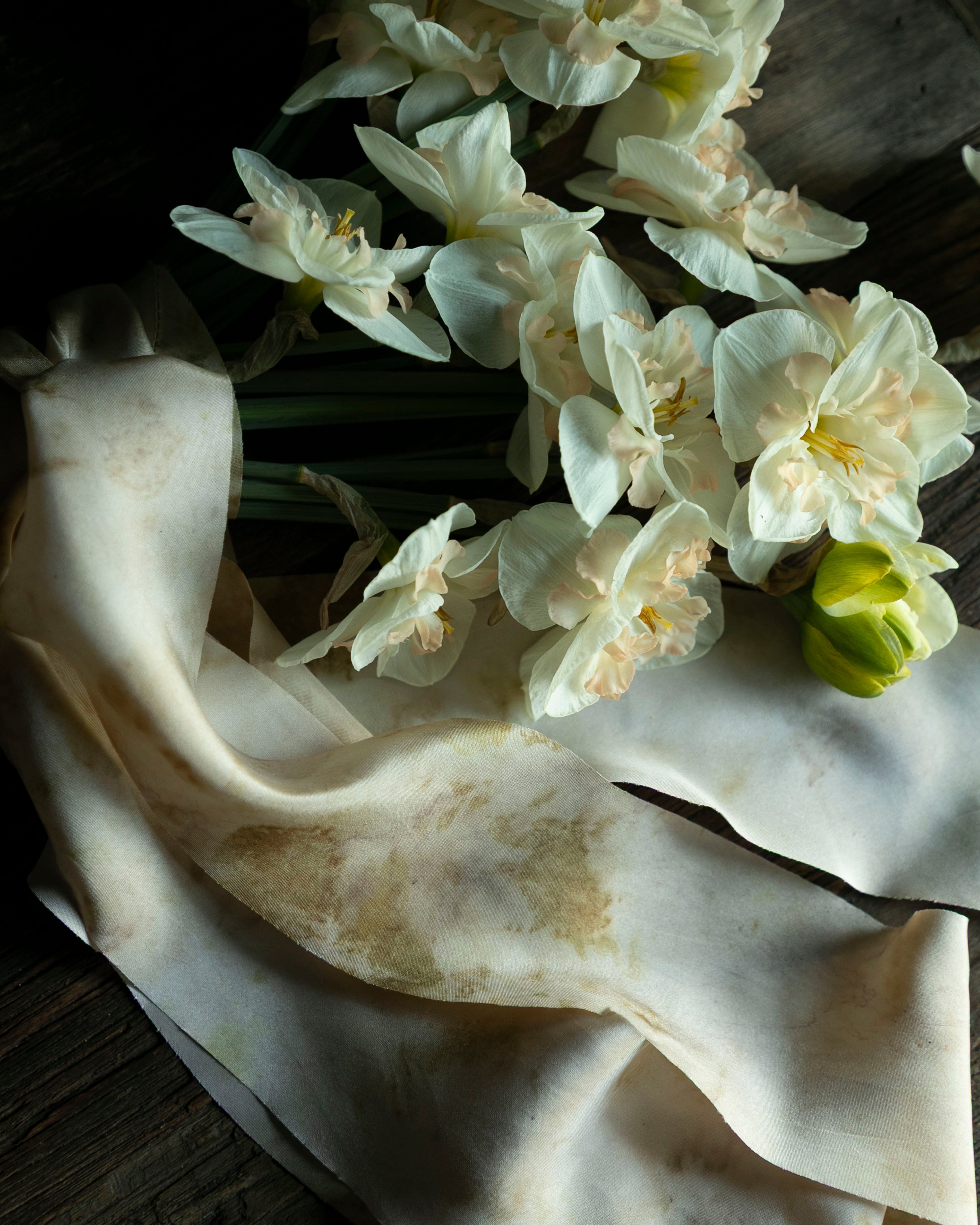 White flowers on a white fabric background