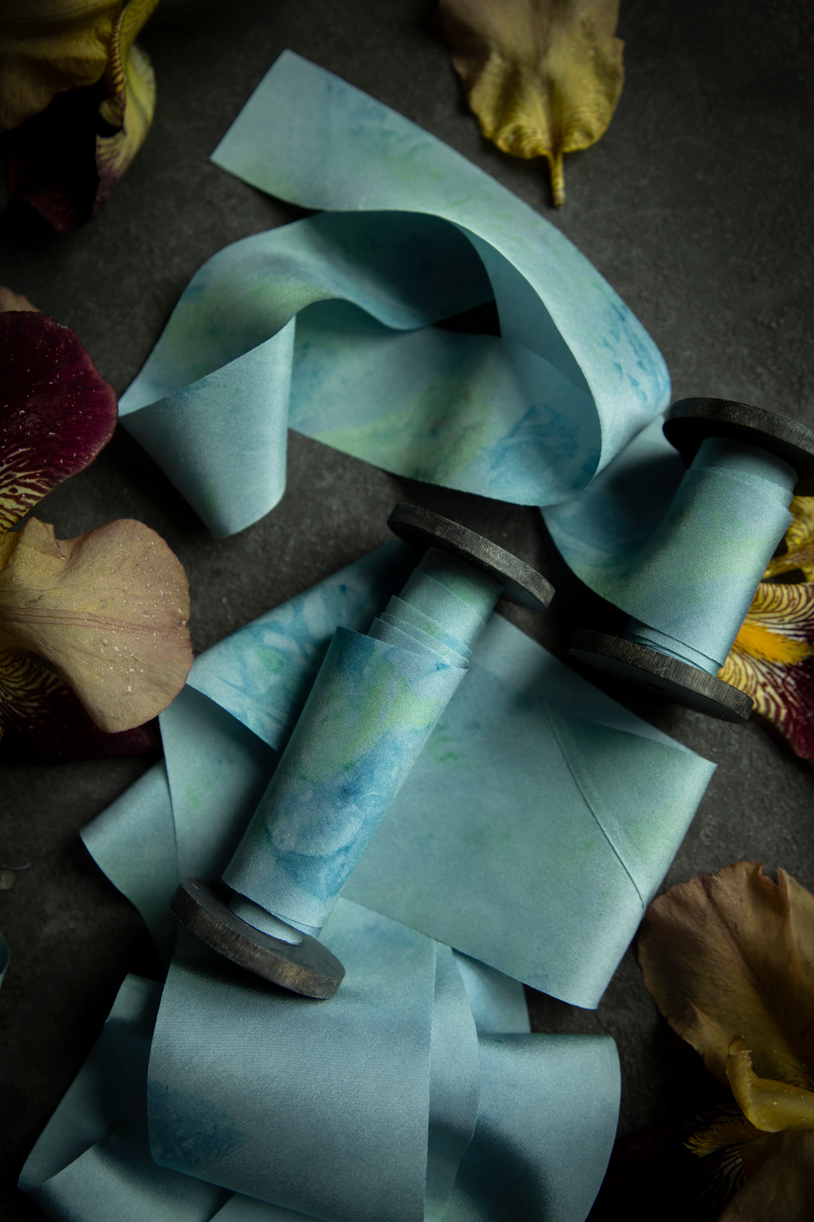 ribbon with watercolor-like texture on a textured surface