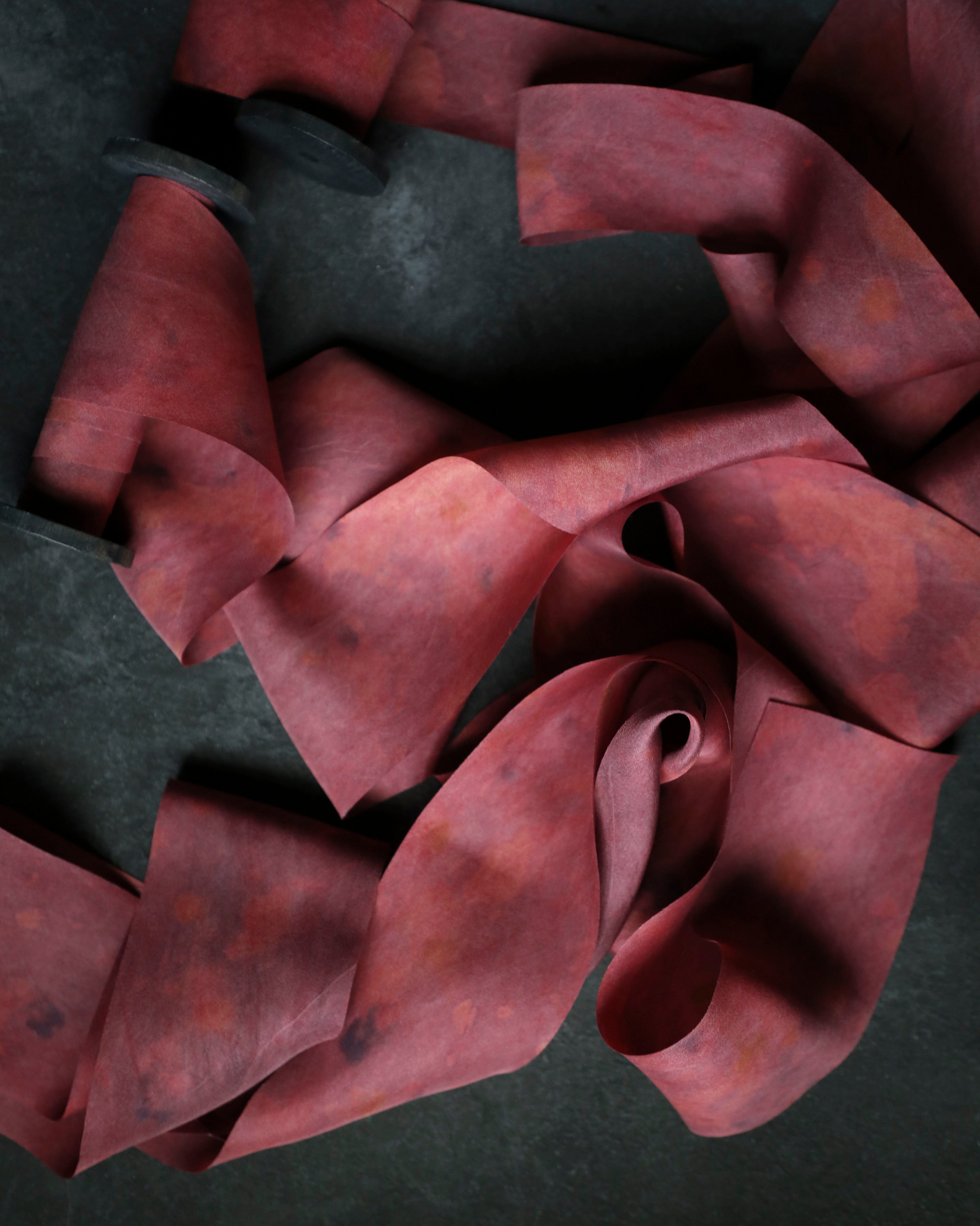 red ribbon on black background