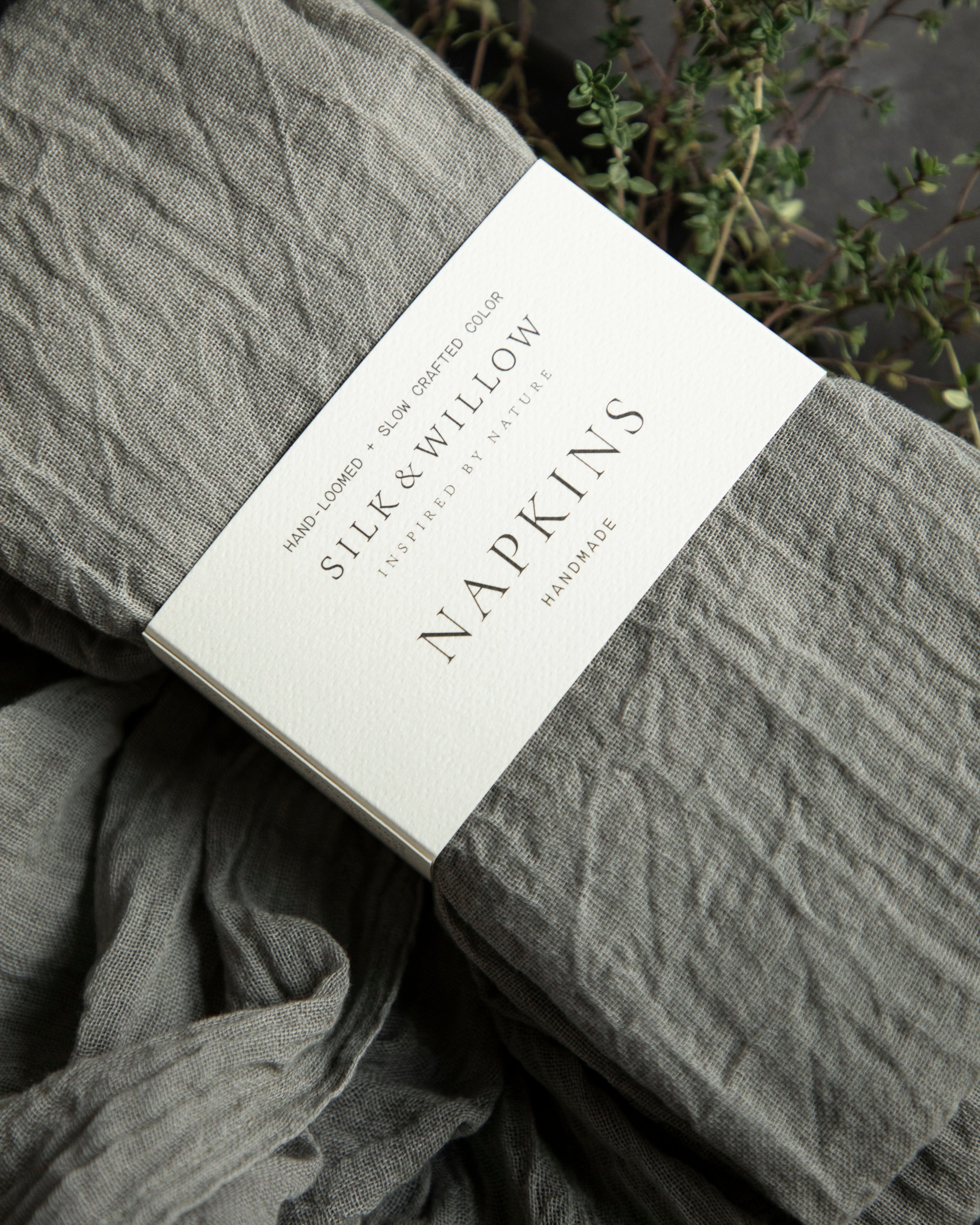 Gray napkins with a label on a dark background