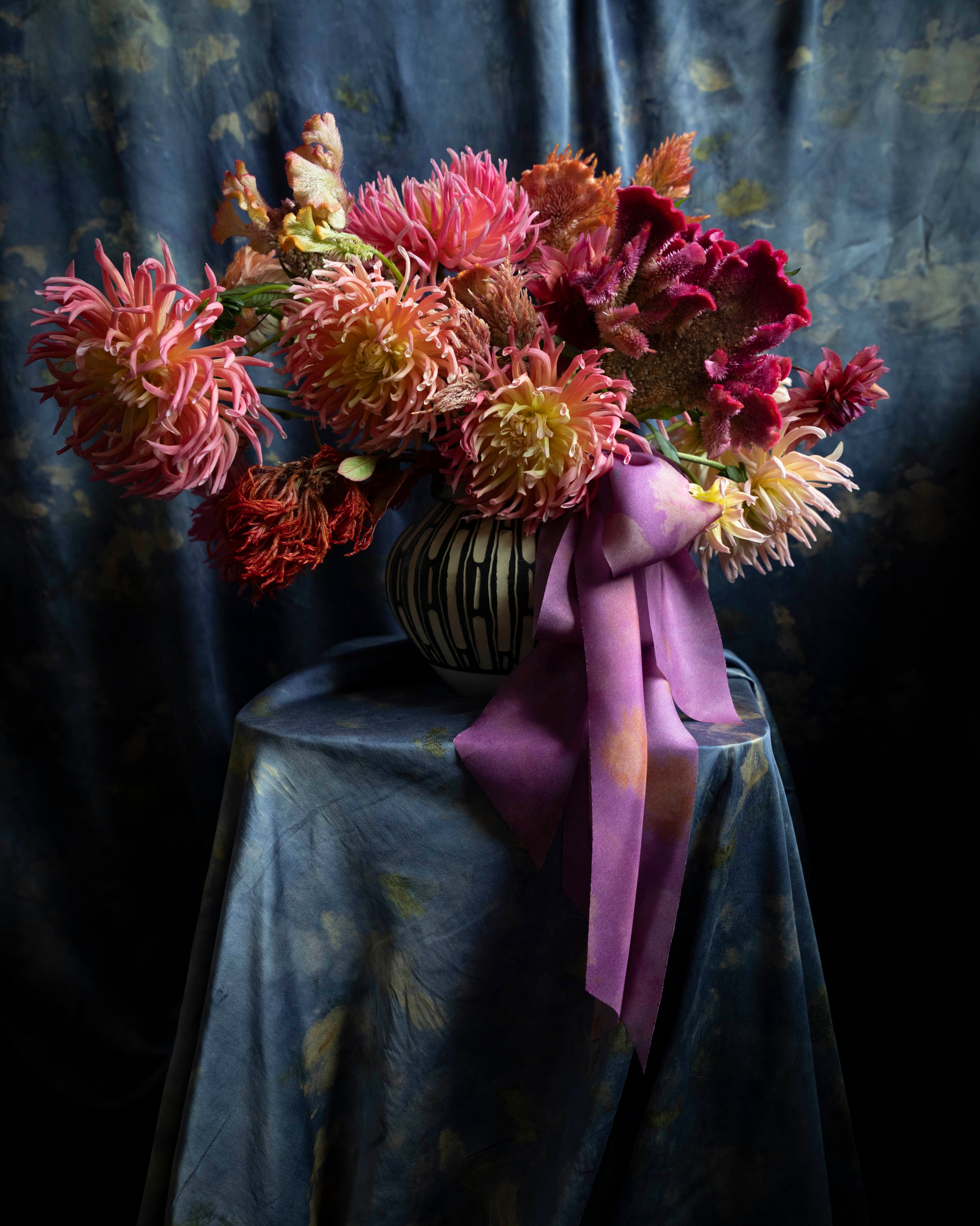 dahlia floral centerpiece tied with silk ribbon bow. Eco-friendly silk ribbons with nature-inspired patterns, perfect for unique gift wrapping and tying market bouquets, crafted from sustainable materials