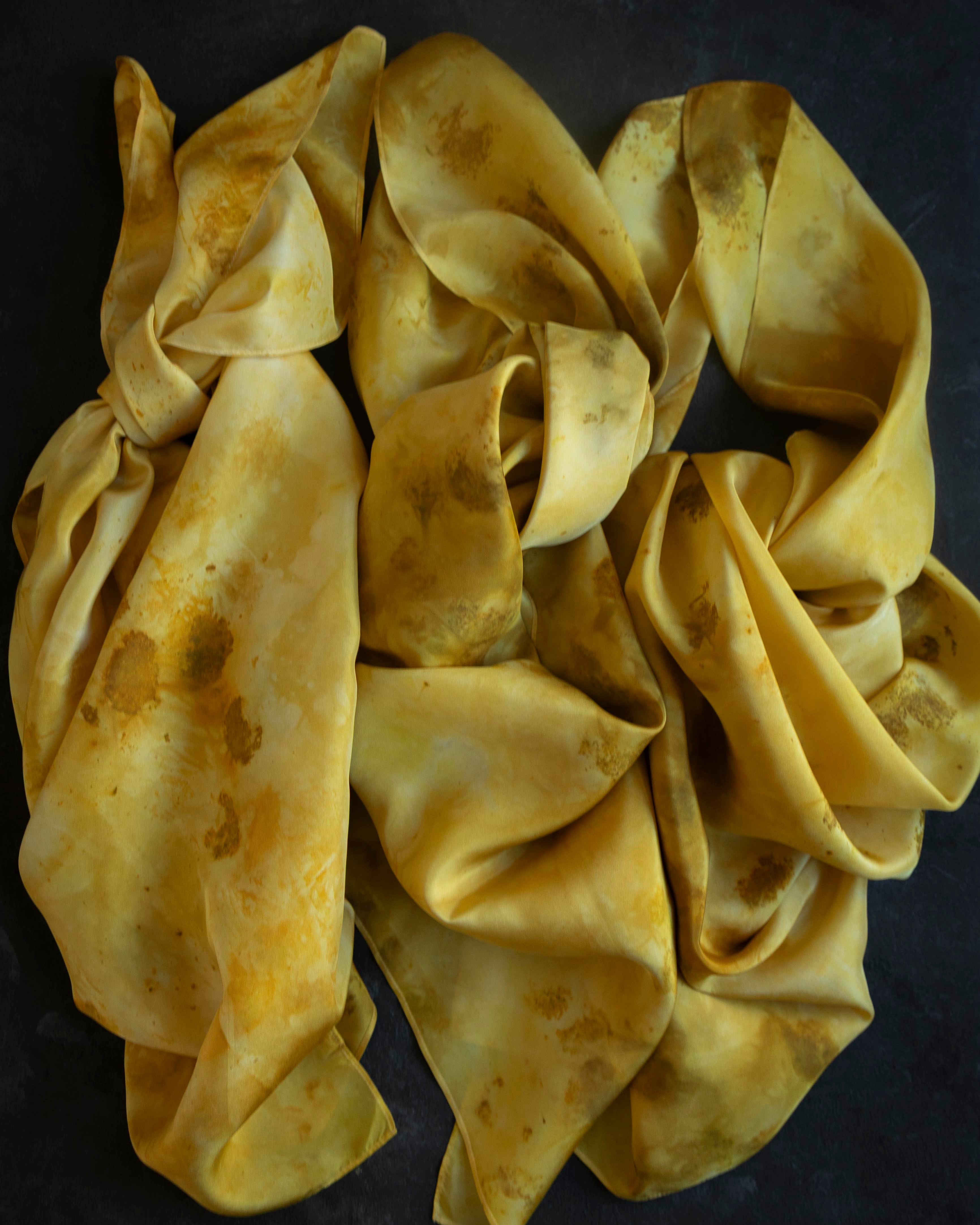 Yellow fabric scrunchie on a dark background