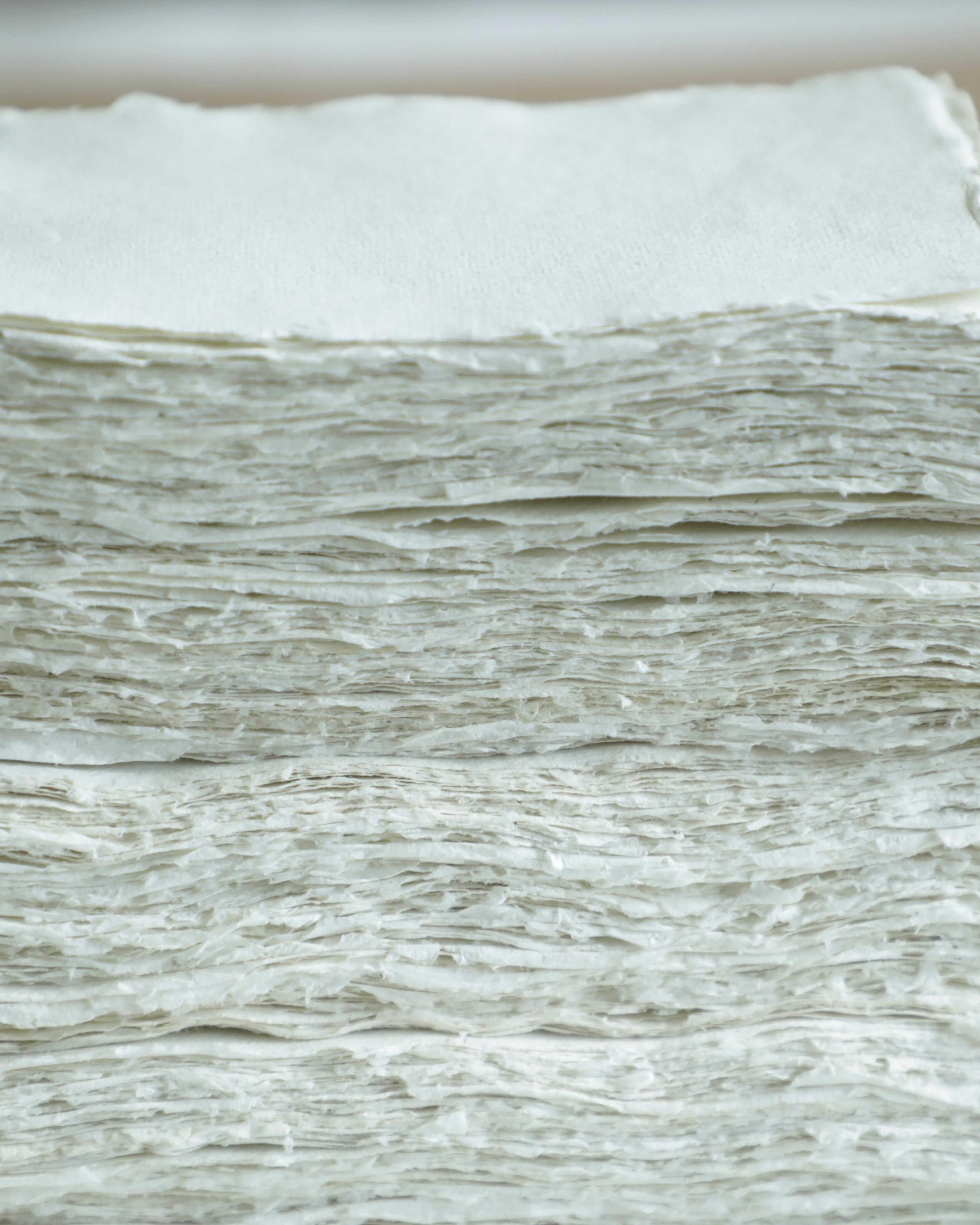 Close-up of a stack of white paper sheets