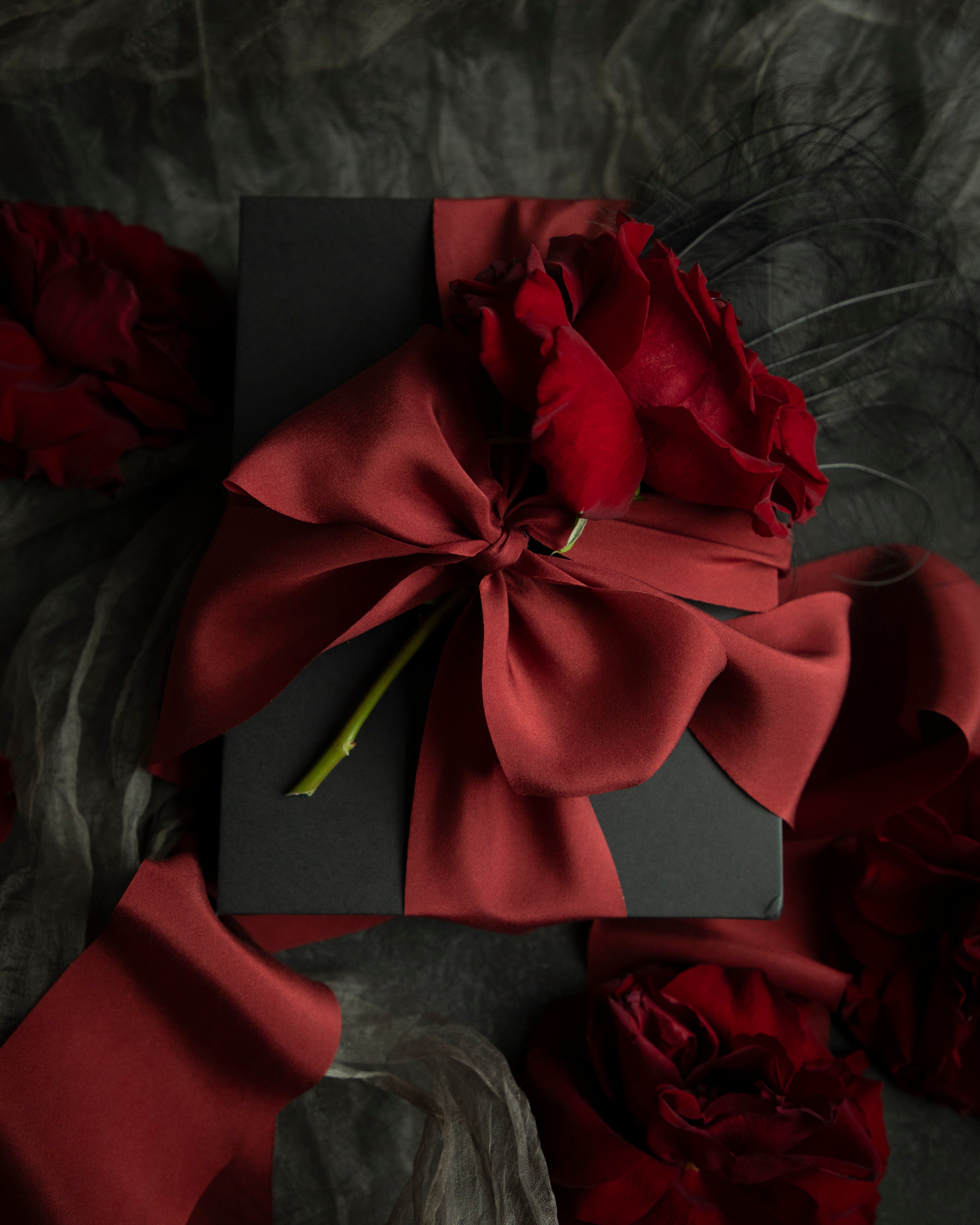 red ribbon gift wrapping. holiday gift wrapping inspiration