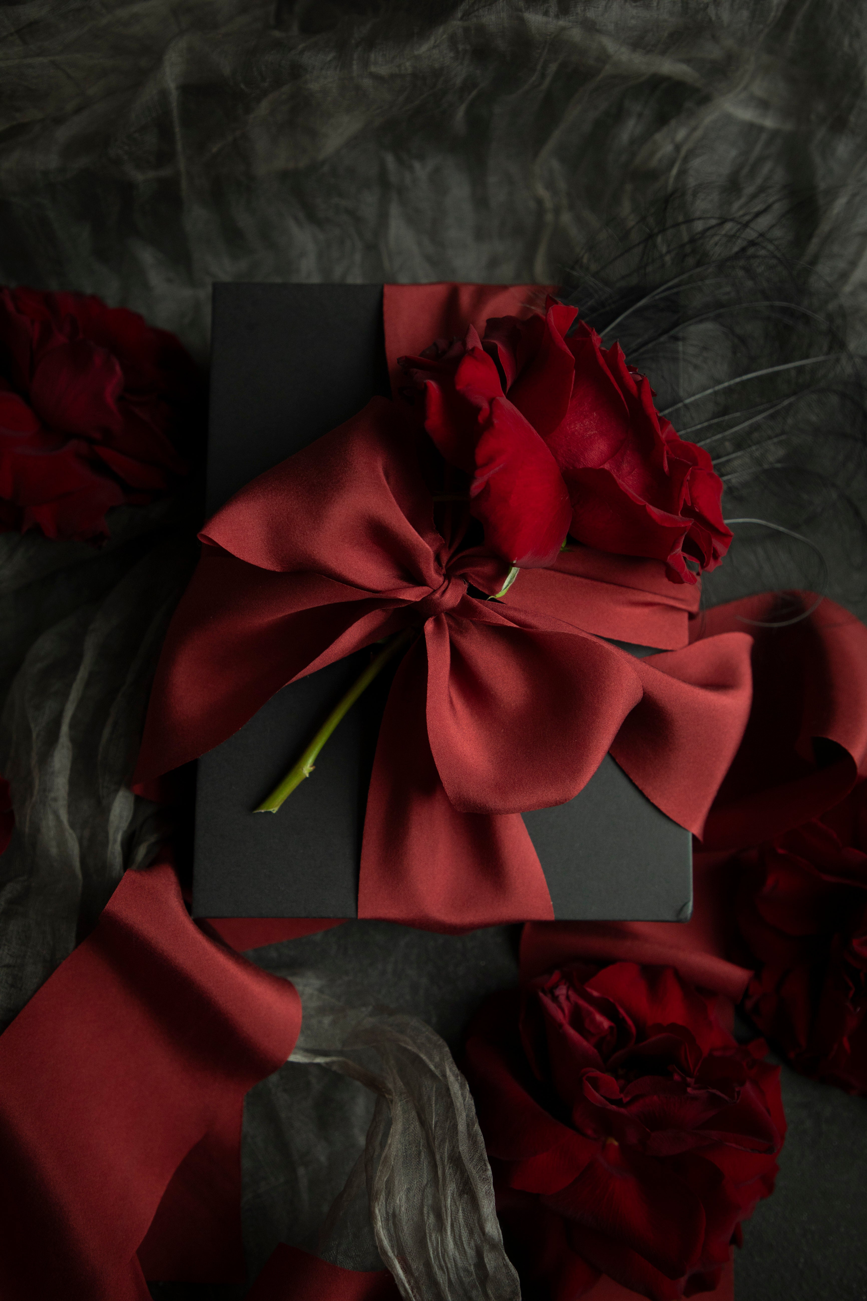 red ribbon gift wrapping. holiday gift wrapping inspiration