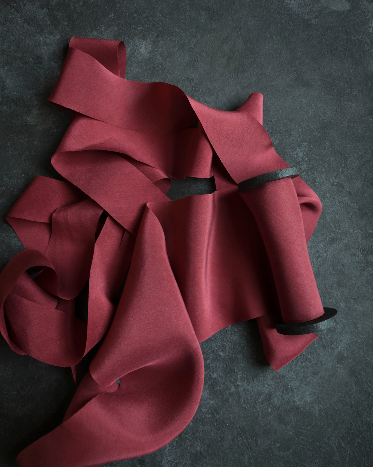 red wedding palette. red silk ribbon bows on candle display. wedding stylist silk and willow