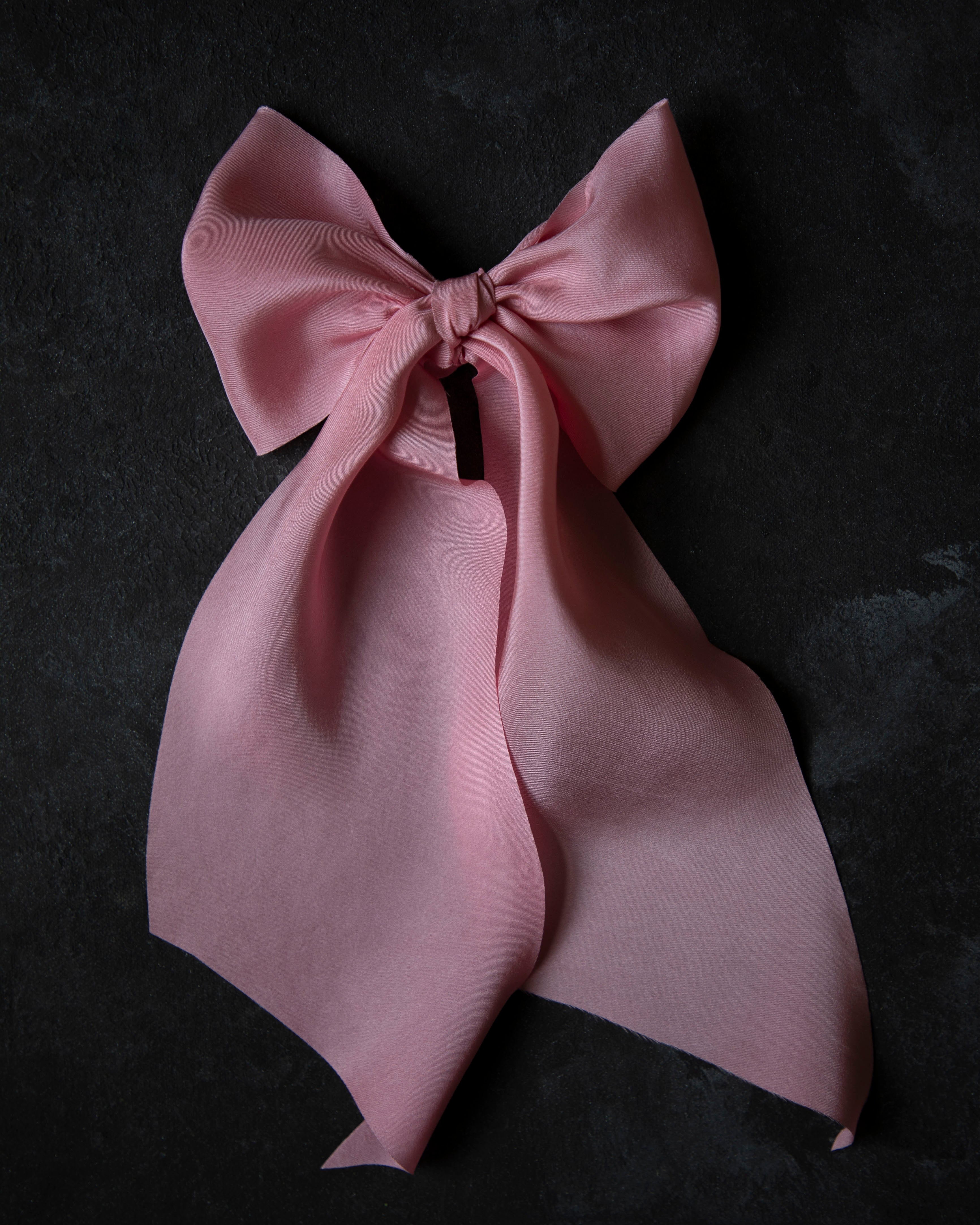 Pink bow on a black background