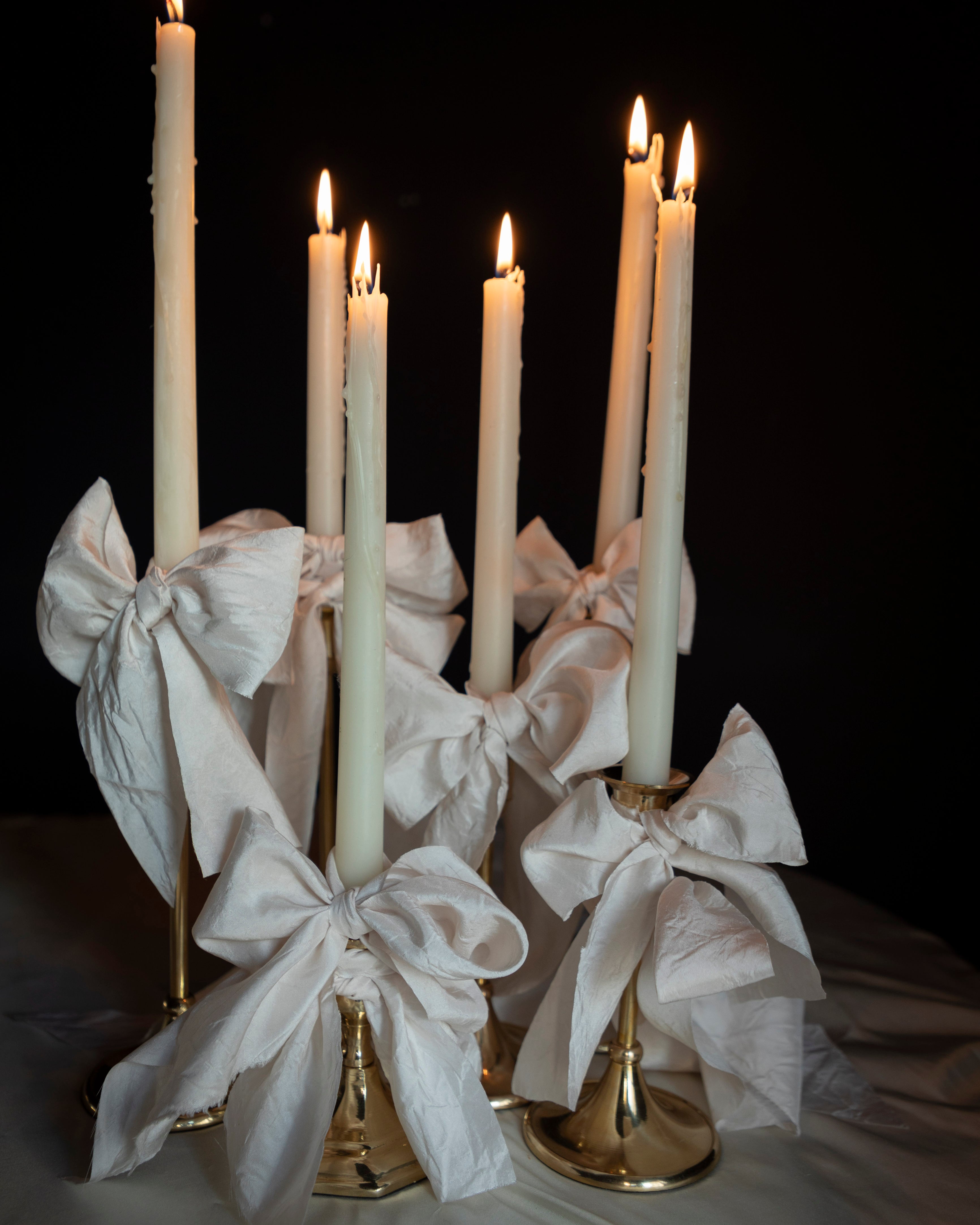bridal white silk ribbon bows on candle display. event design by wedding stylist shellie pomeroy