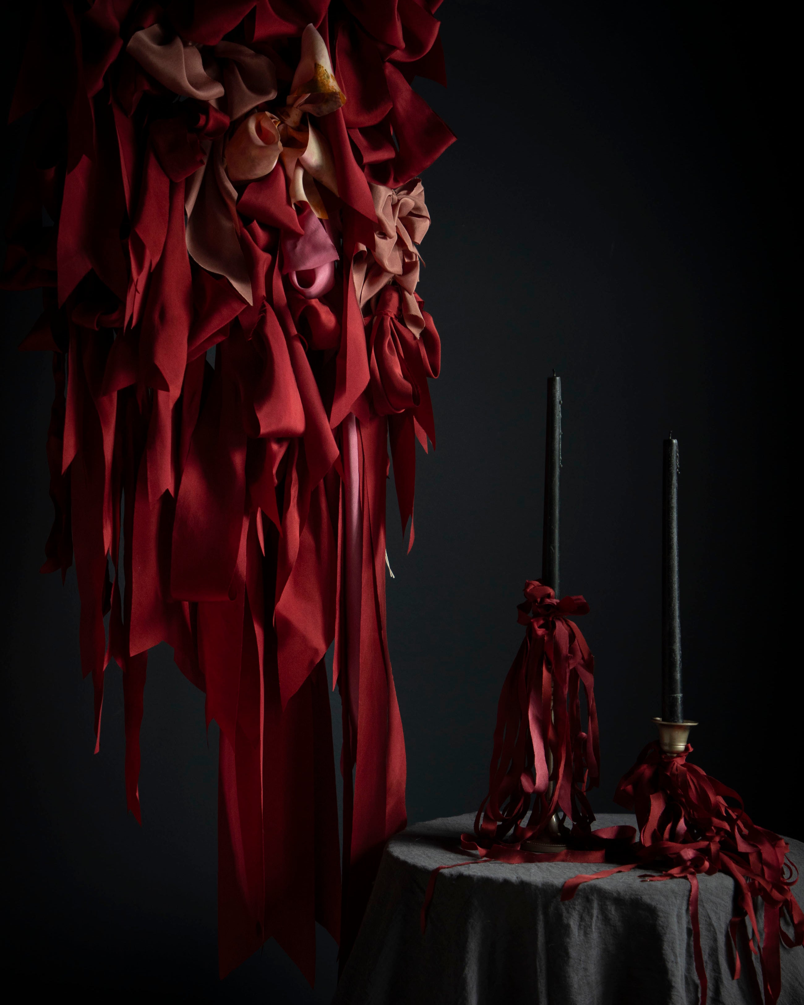 red ribbon display with candles and ribbon bows