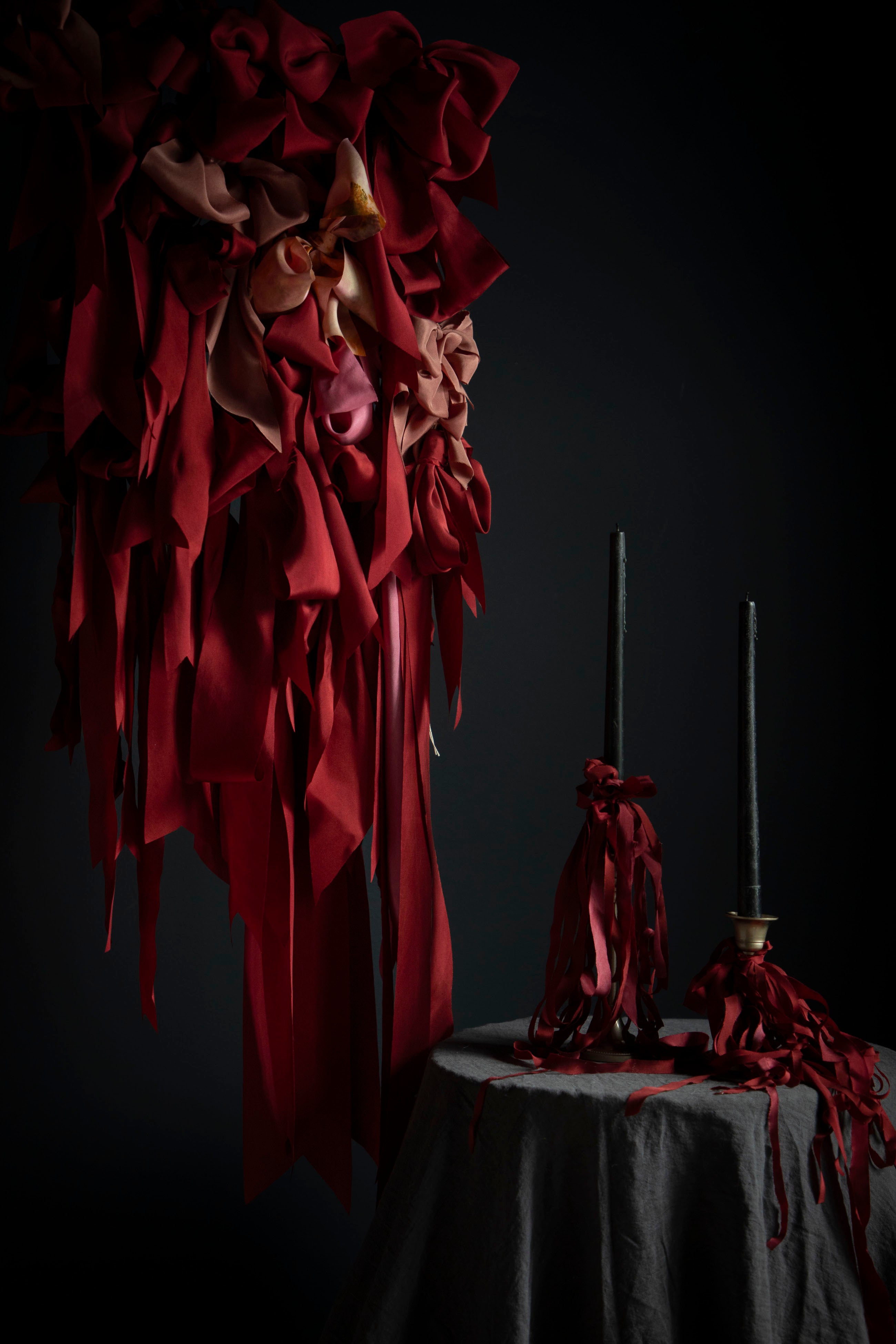 red ribbon display with candles and ribbon bows