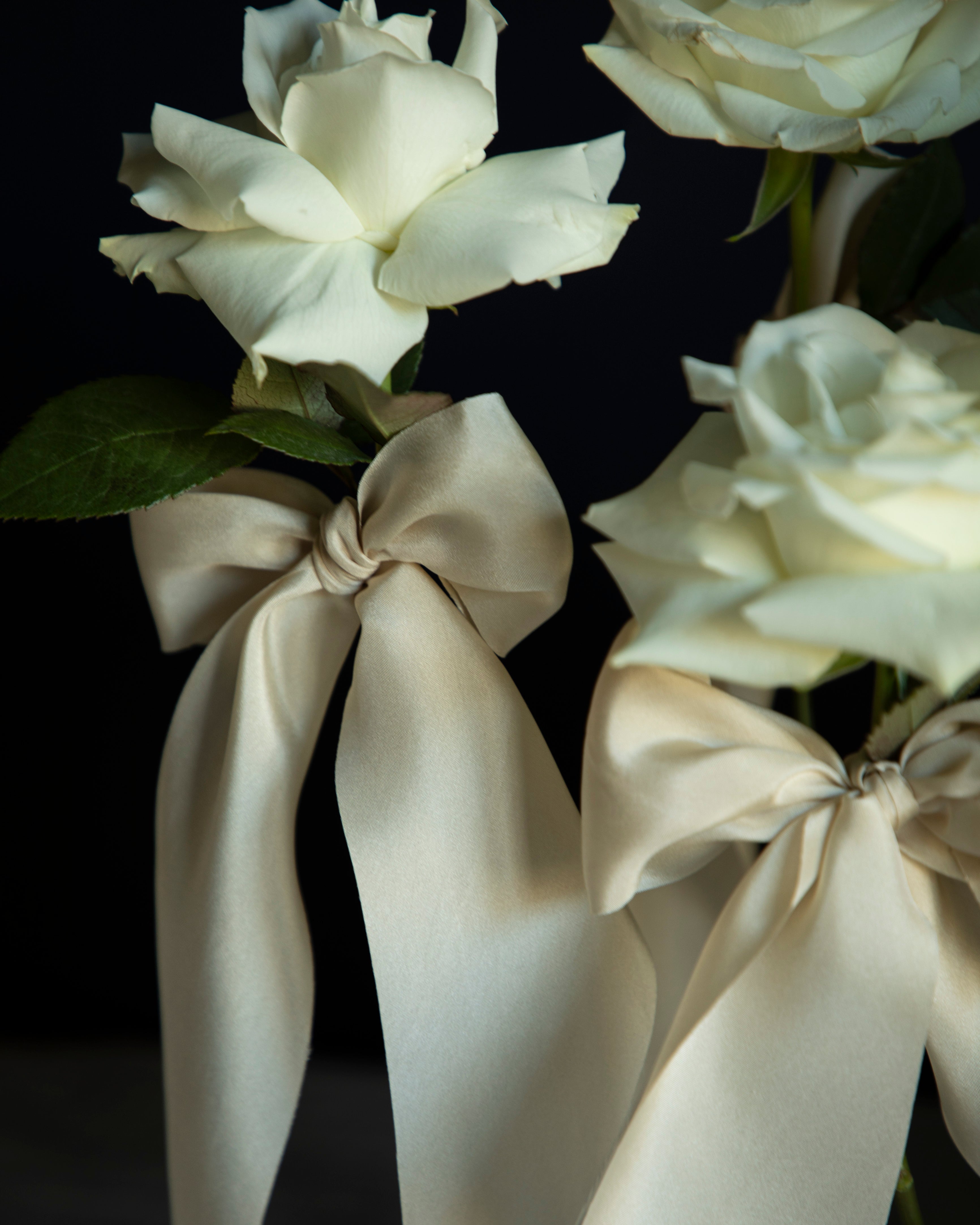 white roses with silk ribbons wedding centerpiece