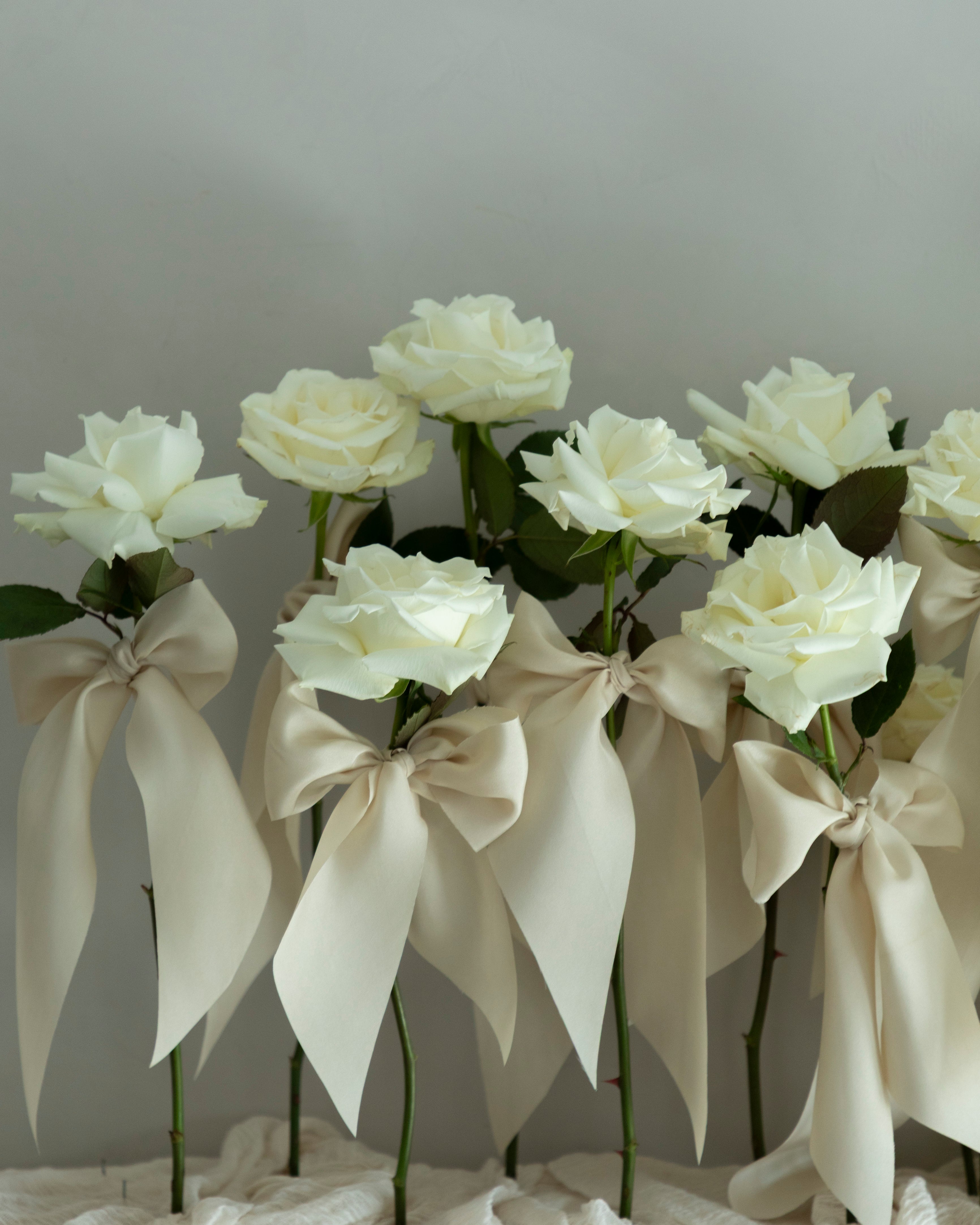 white roses with silk ribbons wedding centerpiece