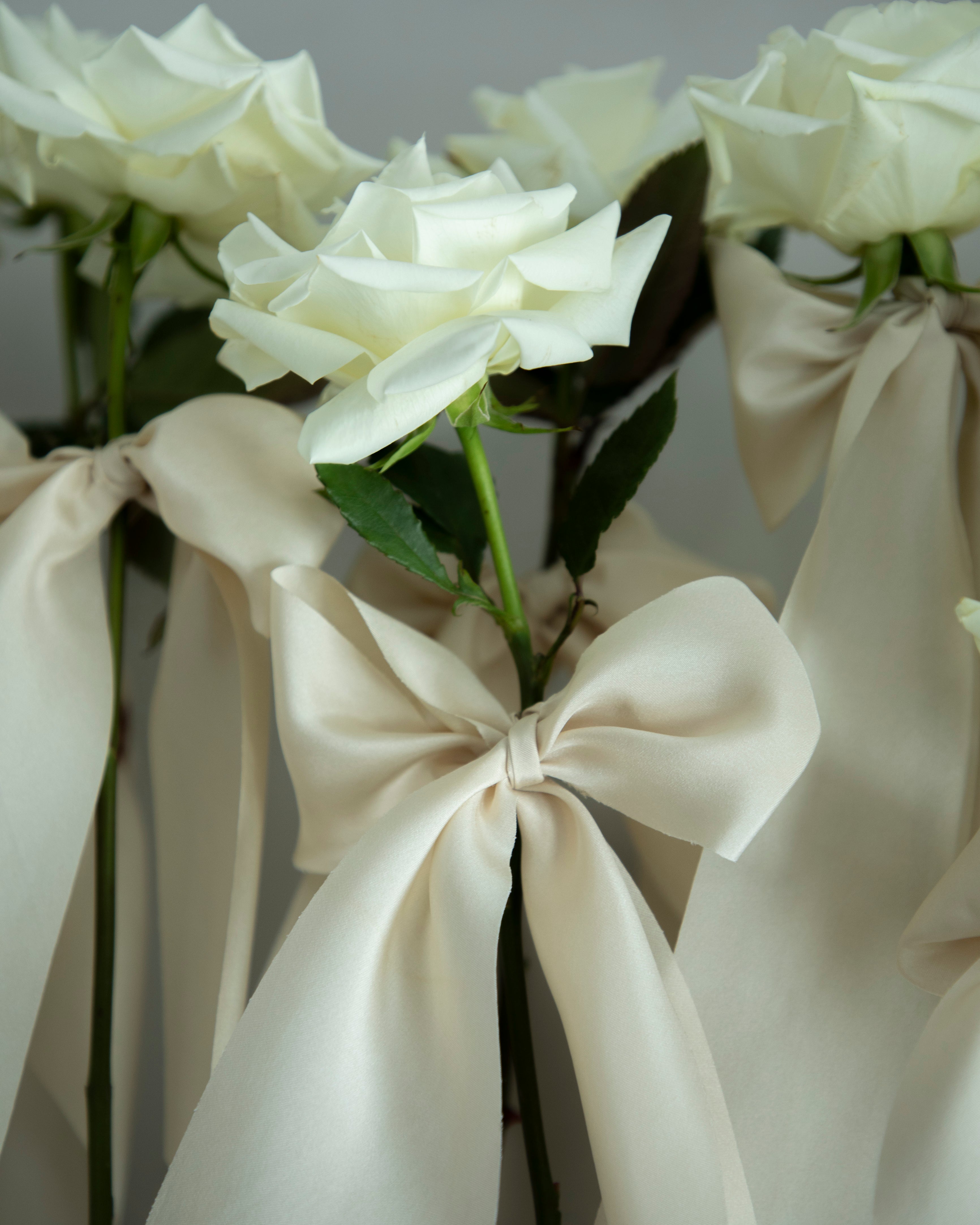 white roses with silk ribbons, unique wedding display