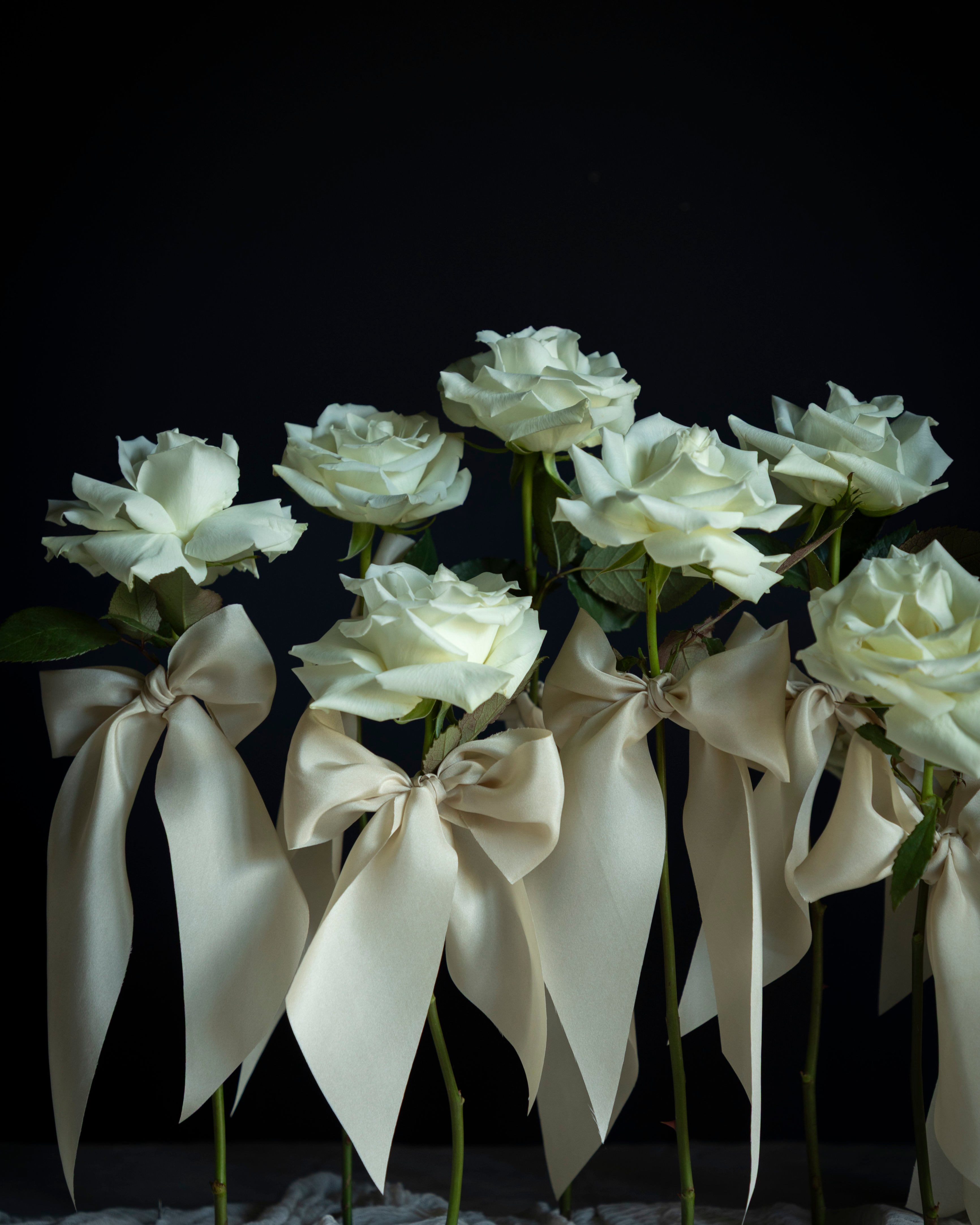 single rose stems wedding display with silk & willow silk ribbons