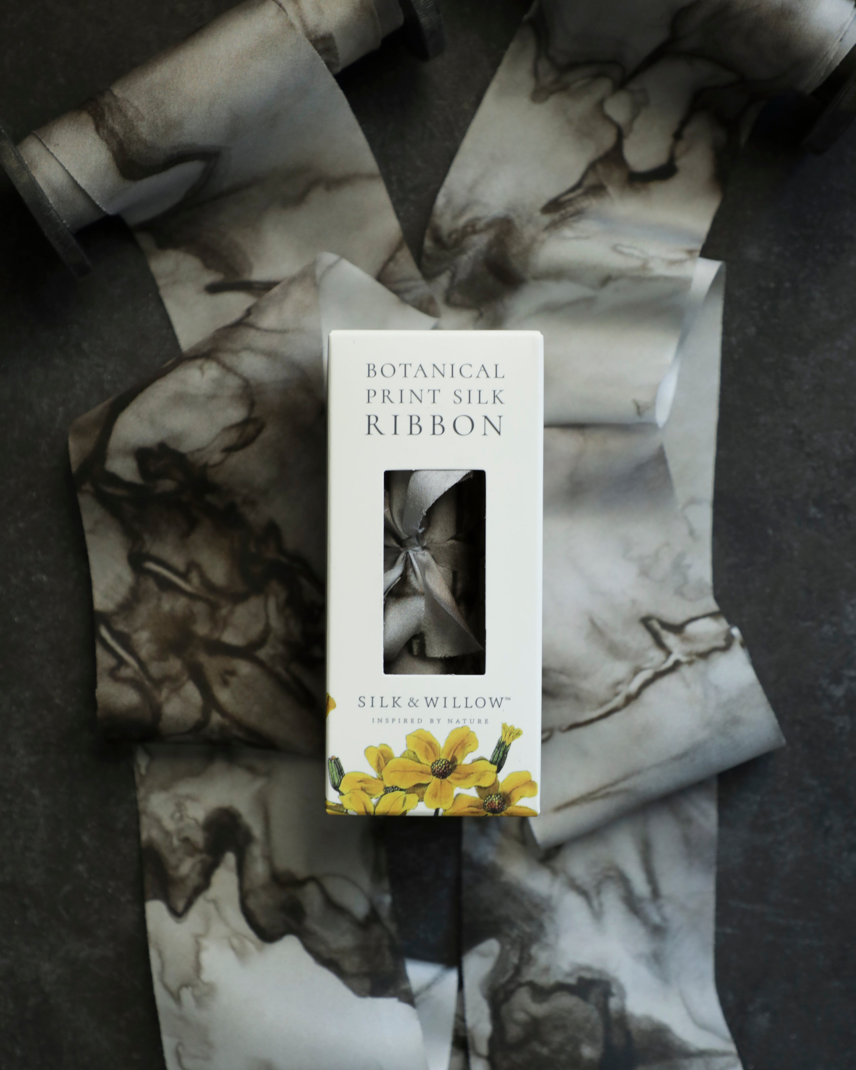 Eco-friendly silk ribbons with nature-inspired patterns, perfect for unique gift wrapping and tying market bouquets, crafted from sustainable materials