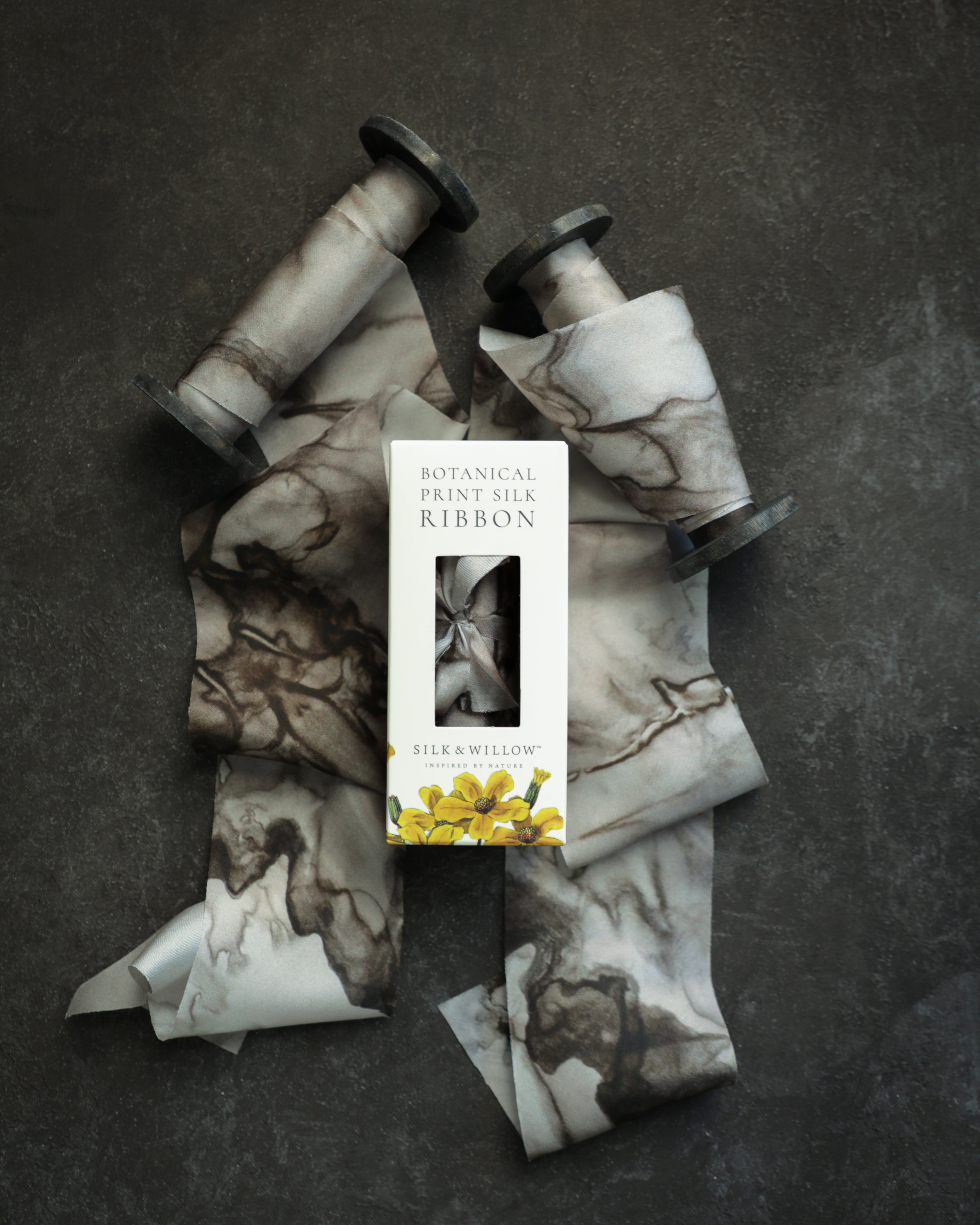 Eco-friendly silk ribbons with nature-inspired patterns, perfect for unique gift wrapping and tying market bouquets, crafted from sustainable materials