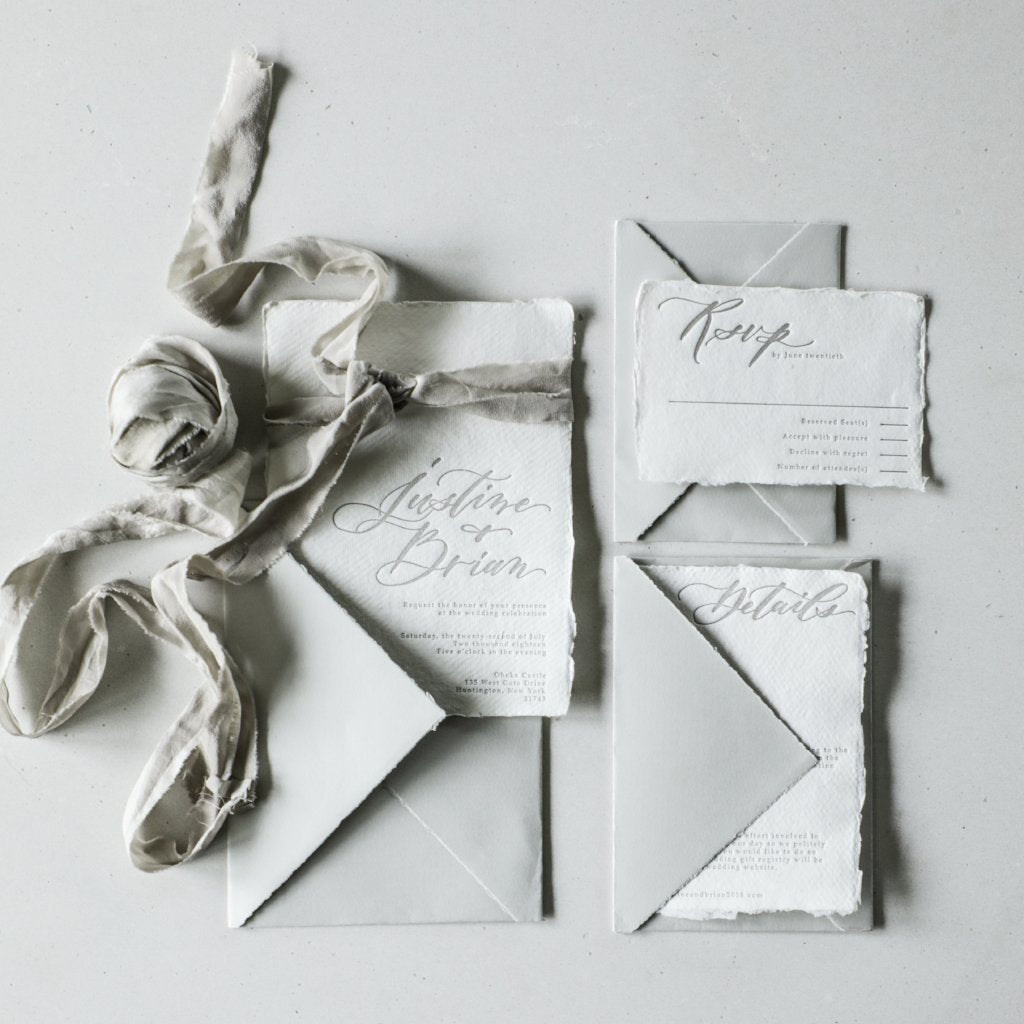 custom wedding invitations on silk and willow handmade paper with gray arpa envelopes and silk ribbon