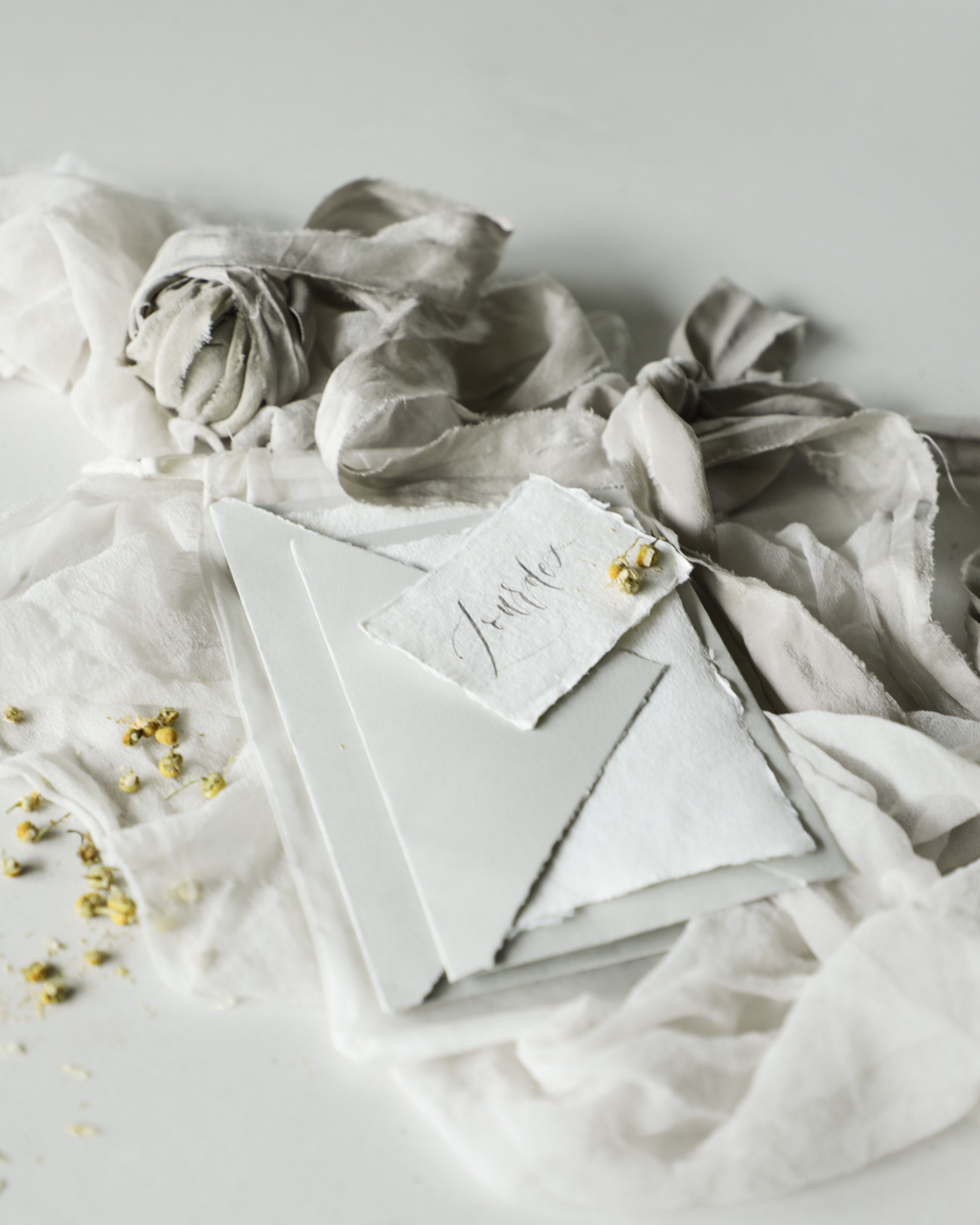 hand calligraphy on handmade deckled edge paper by silk and willow