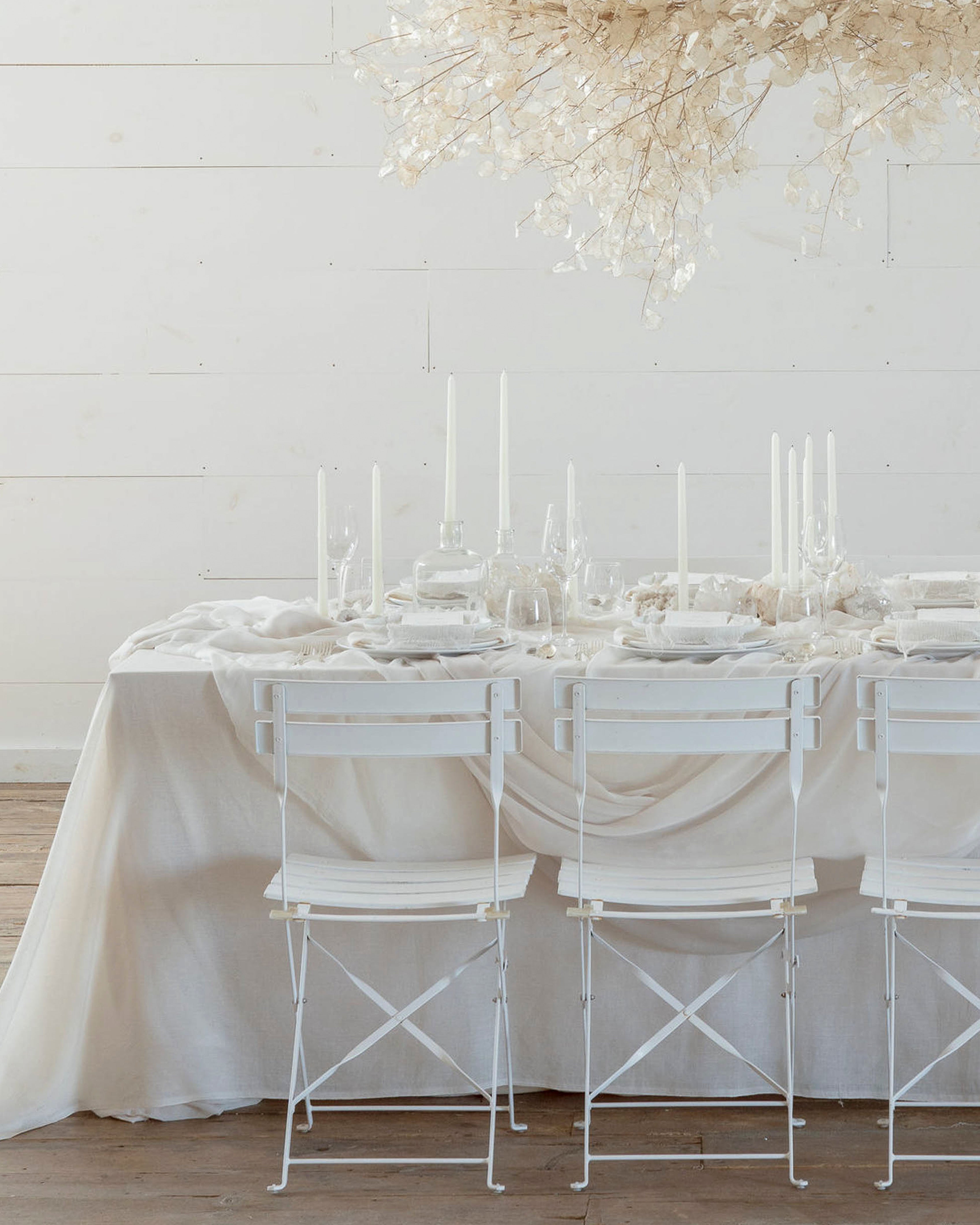 wedding table setting with monochromatic white table decor