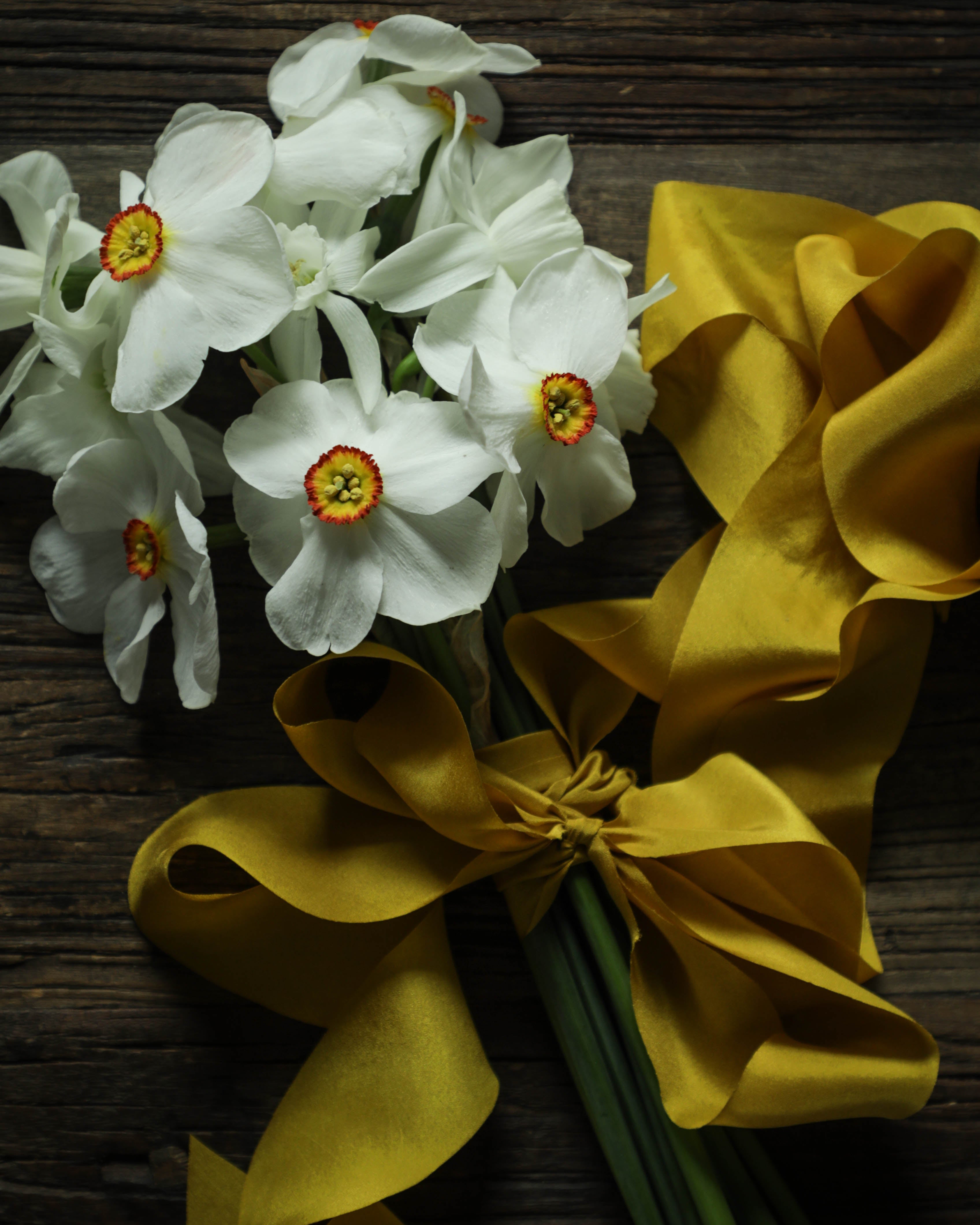 daffodil flower bouquet with yellow ribbon. Ideal for wrapping bridal bouquets, this ribbon is perfect for brides-to-be, engaged couples, and florists looking to add a touch of sophistication to wedding arrangements.