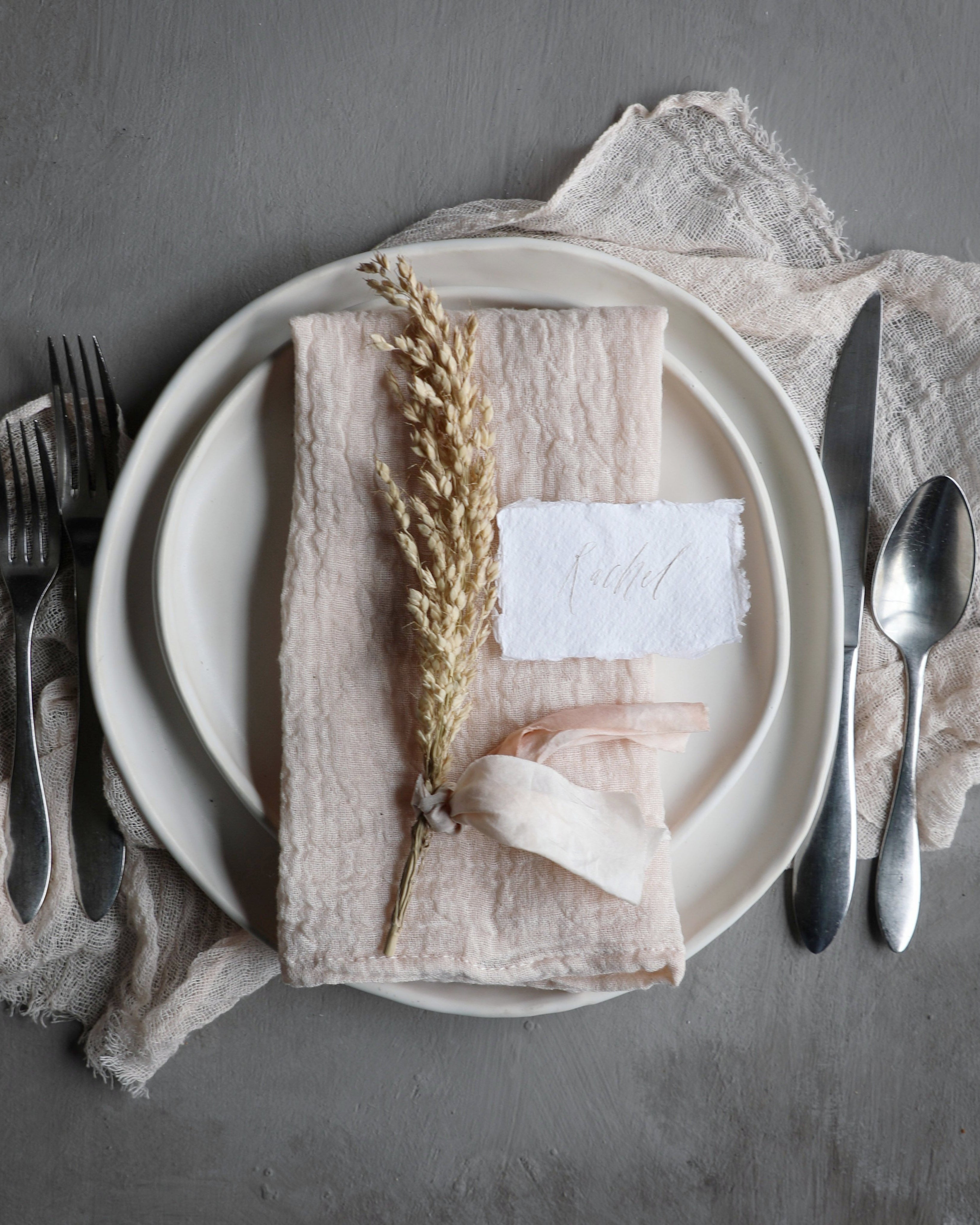 Example of a place setting idea with Silk and Willow Hand-loomed cotton napkins and handmade ceramic plates