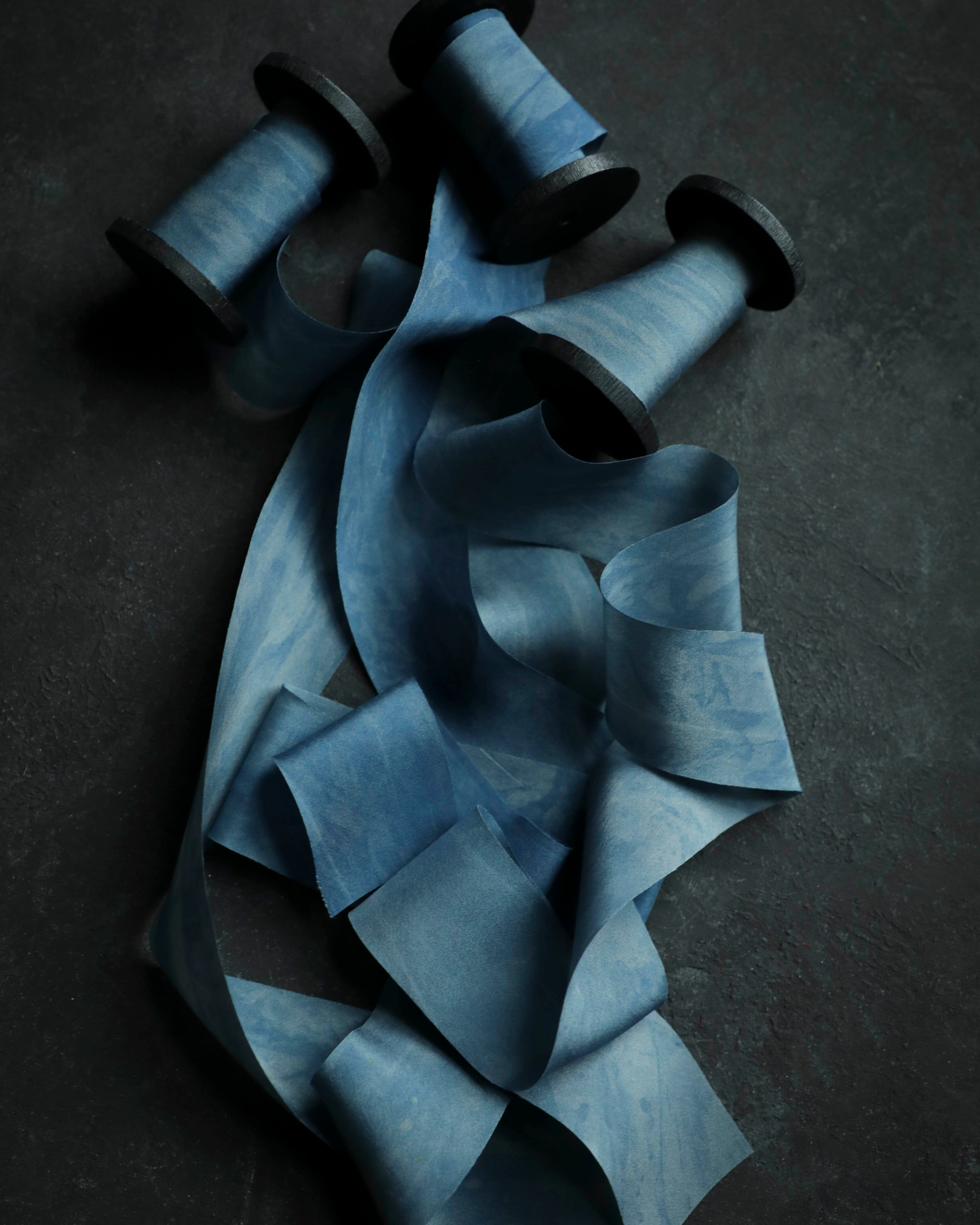photography flatlay styling with indigo blue silk ribbons