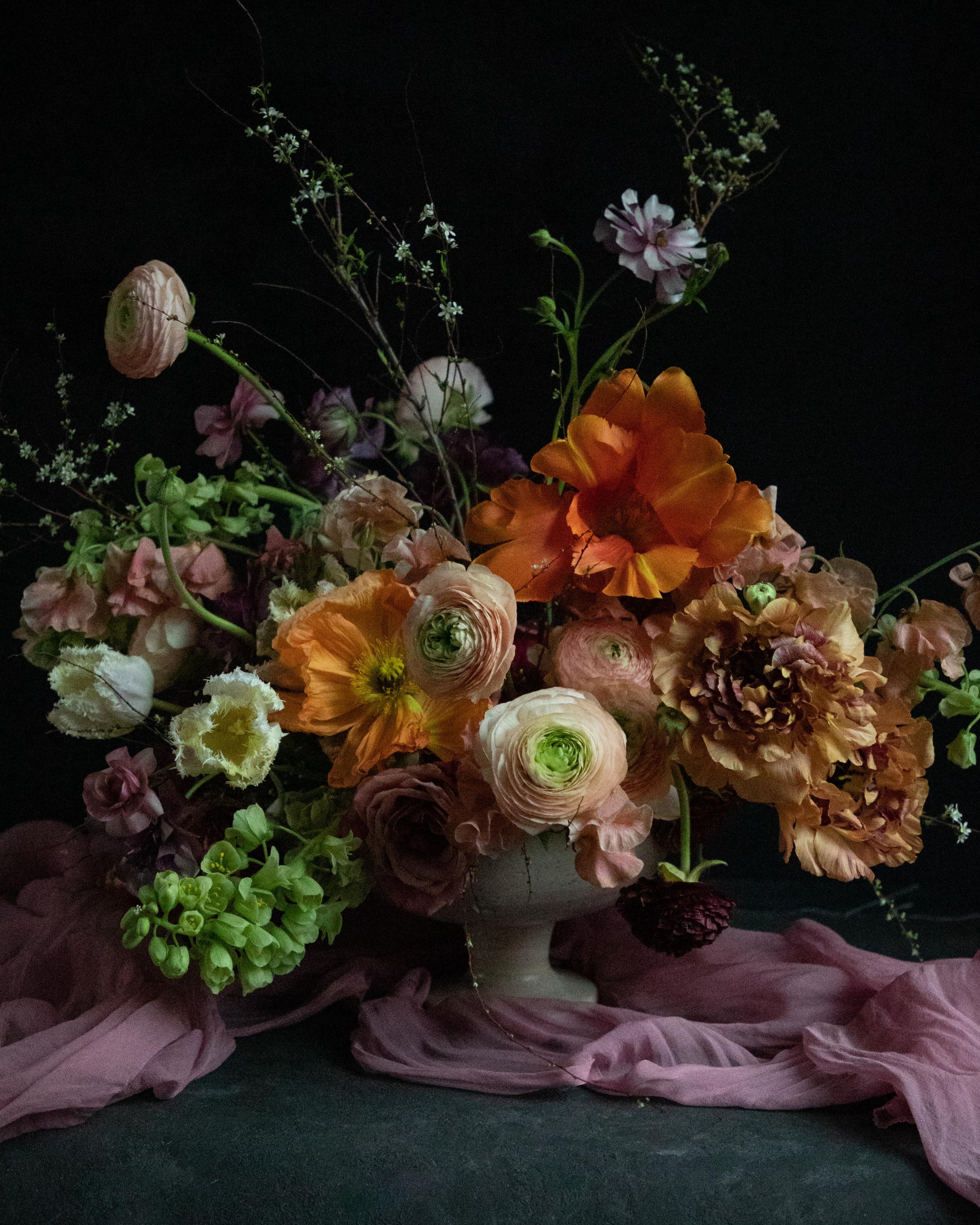 wedding floral centerpiece with sheer silk runner