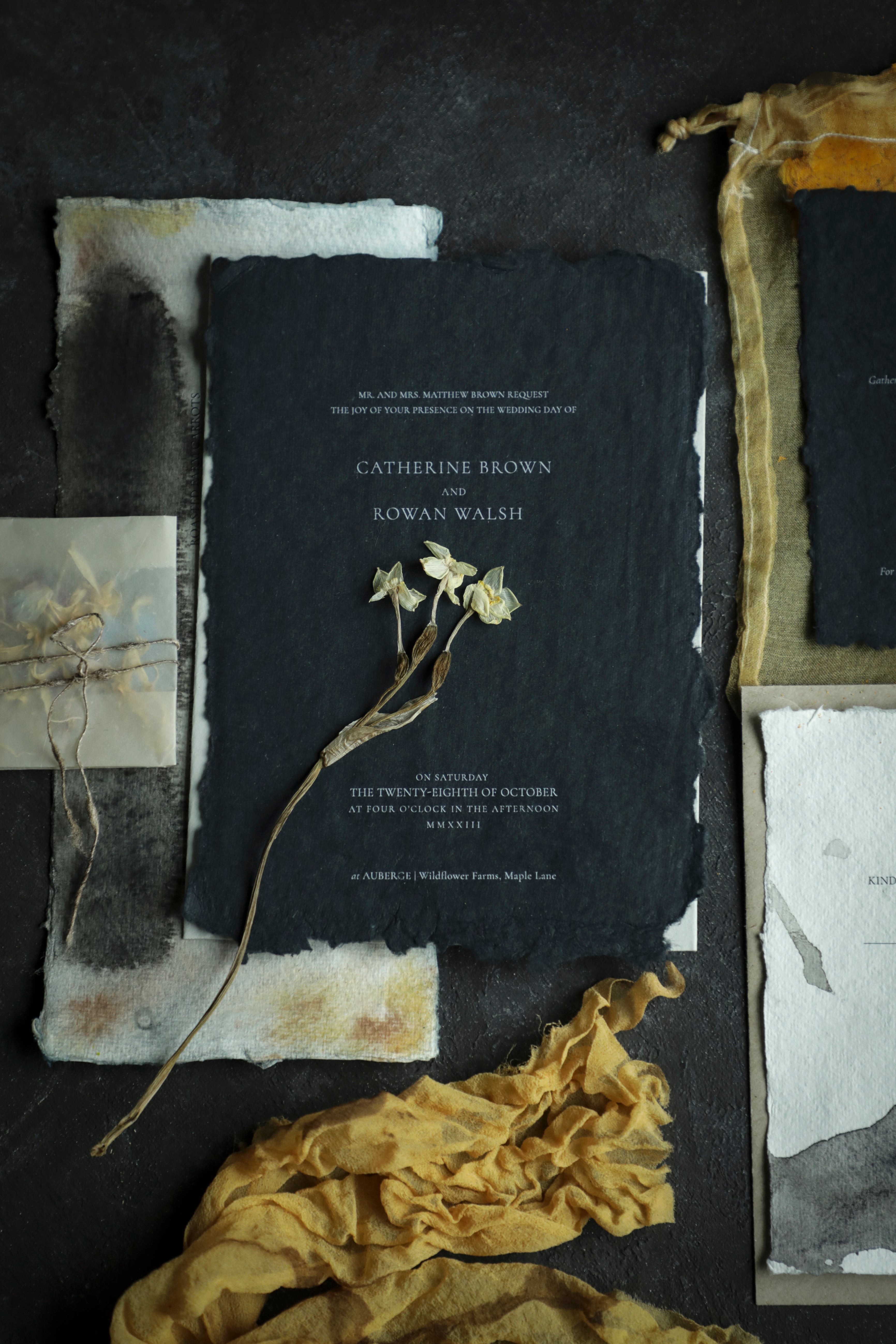 wedding invite on black handmade paper and white ink toner