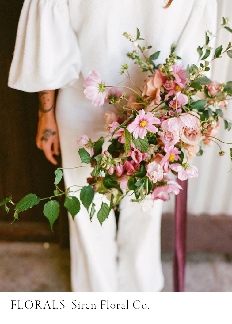 bridal bouquet with soft mauve hues tied with burgundy silk ribbon.