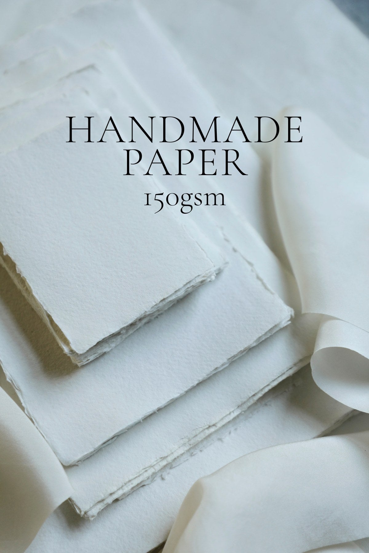 Stack of handmade paper with text indicating weight on a light background